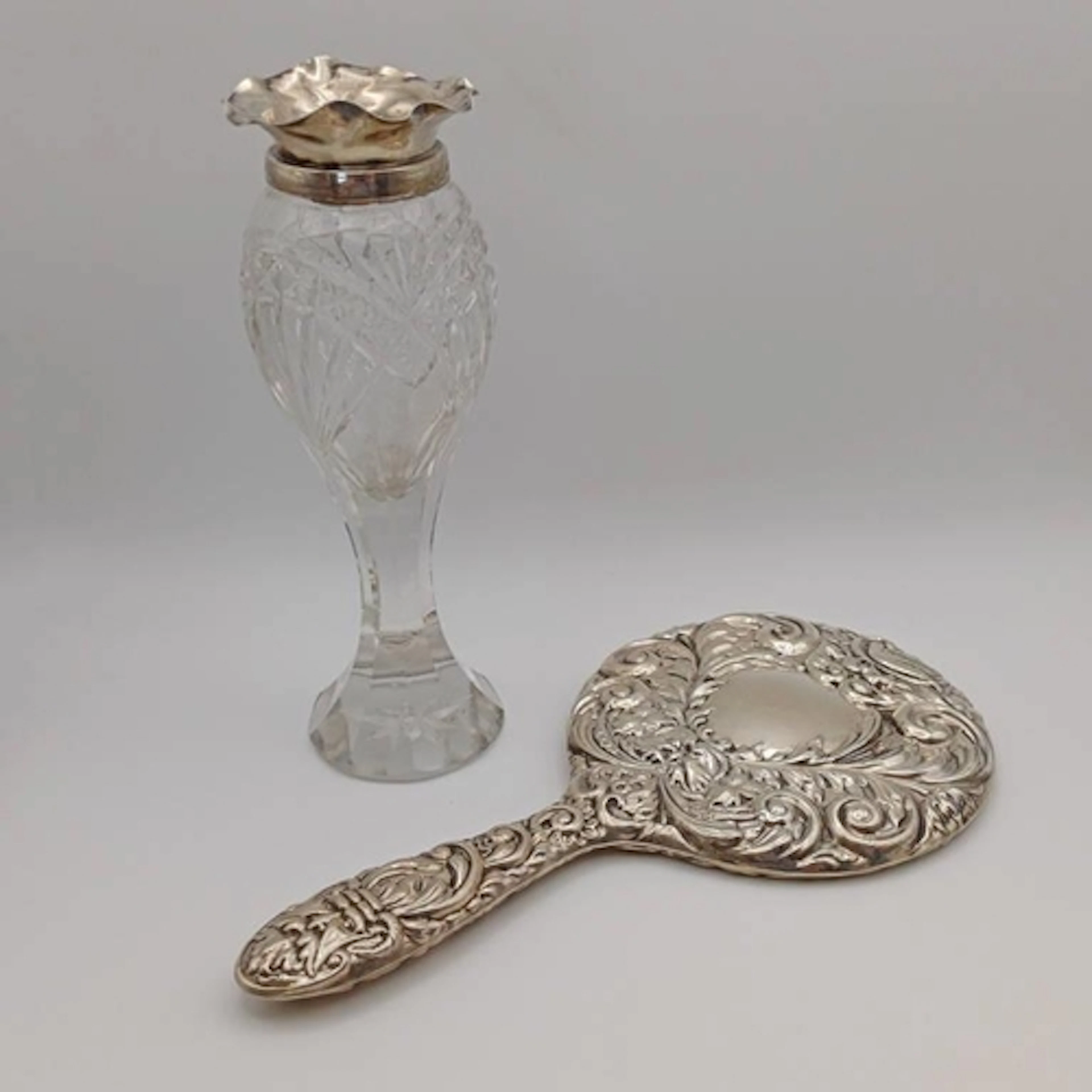 A SILVER MOUNTED CUT GLASS VASE BY ARTHUR JOSEPH MASON, BIRM...