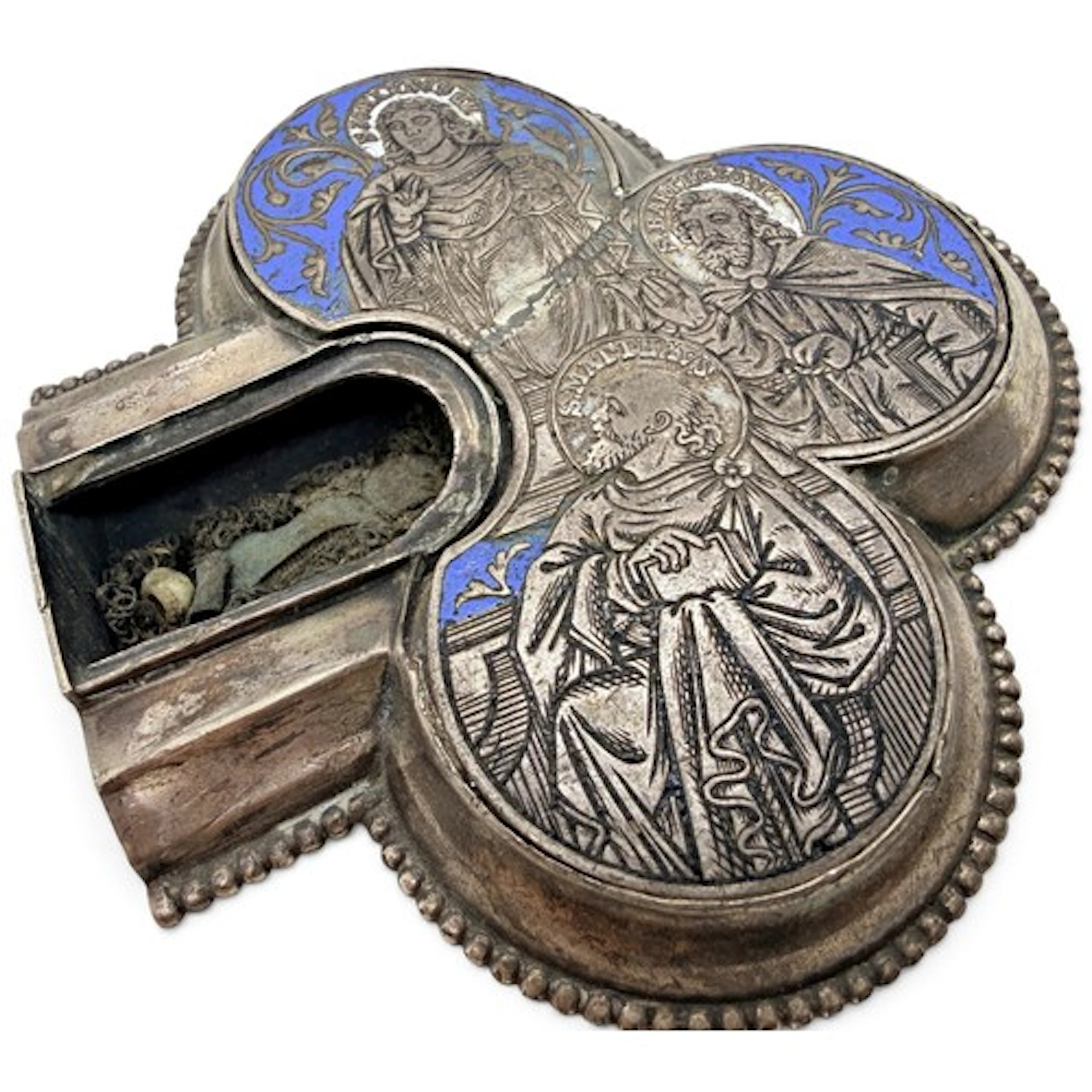 A white metal and enamel trefoil reliquary, engraved with Sa...