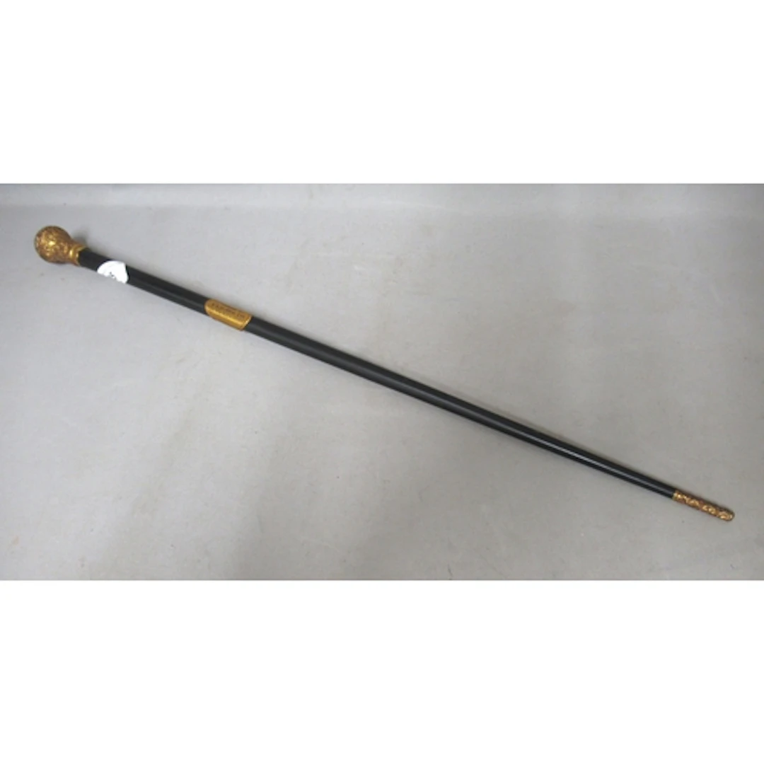 Gilt brass and ebony conductor's baton, with presentation in...