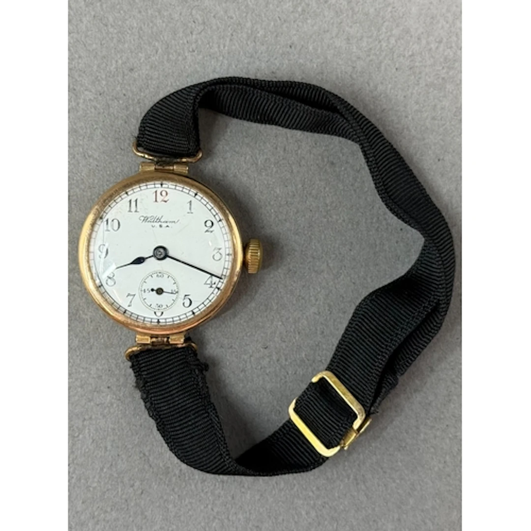 Watches: a 9ct gold cased Waltham wristwatch on ribbon strap...