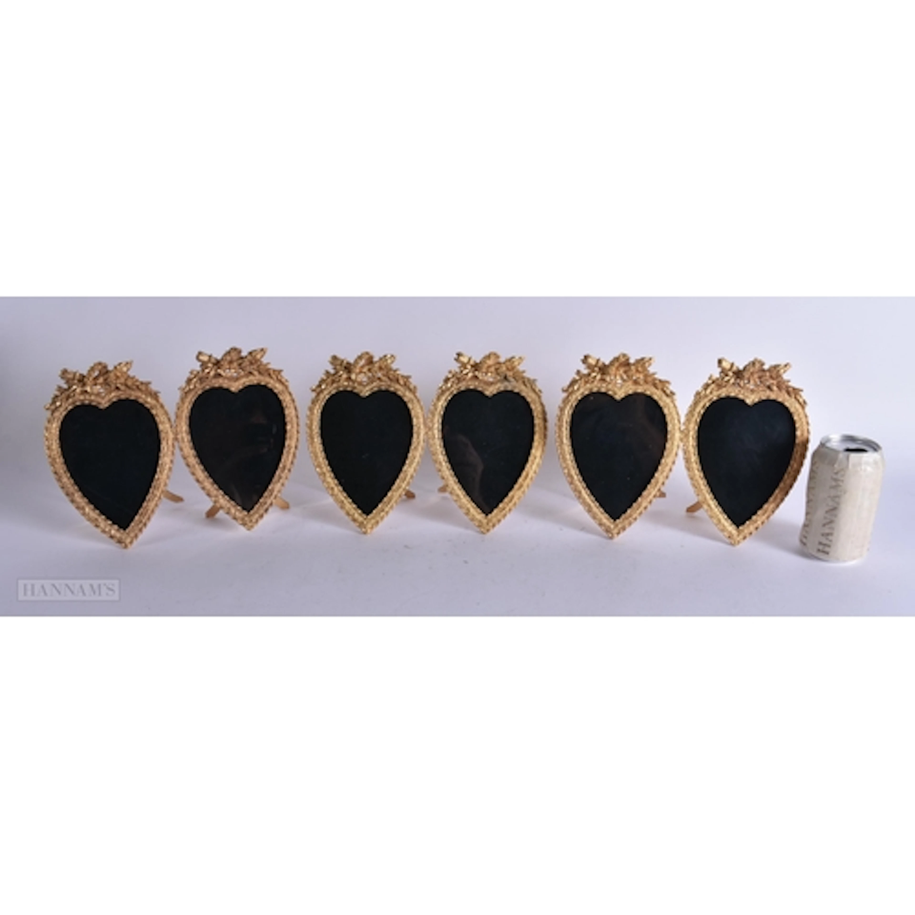 A SET OF THREE GILT METAL DOUBLE HEART PHOTOGRAPH FRAMES. 24...