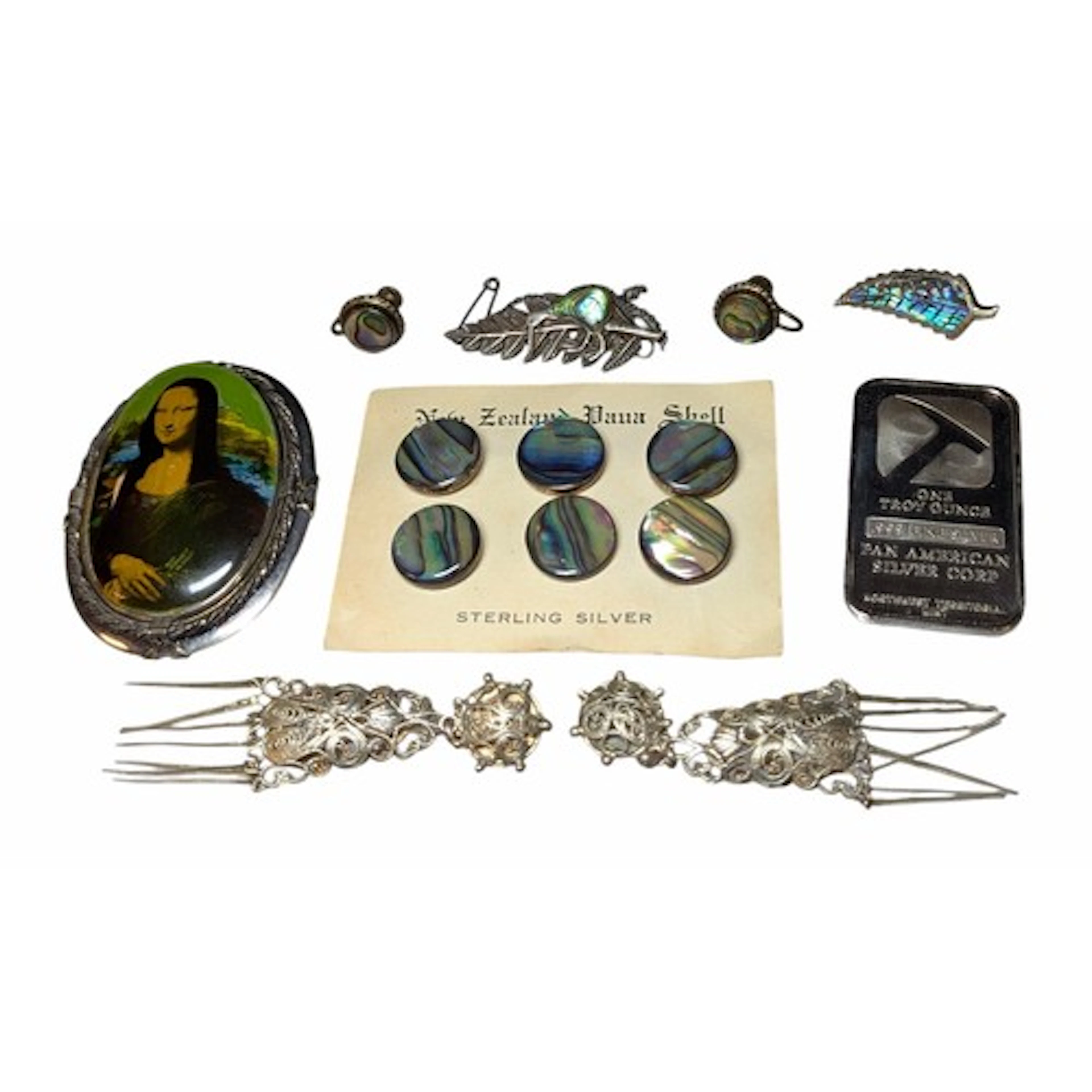 A selection of silver and unmarked white metal jewellery and...