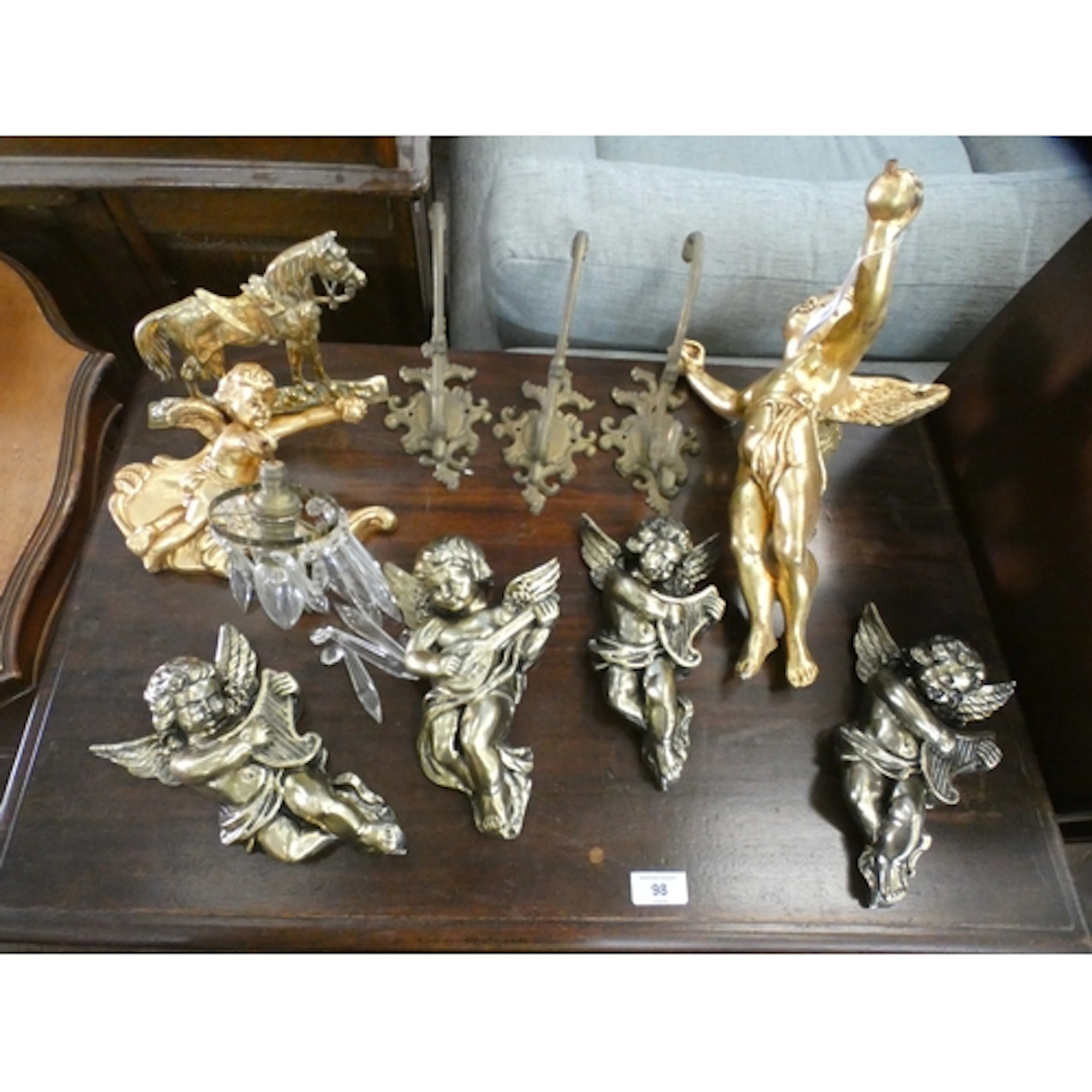 A cherub wall light, assorted cherub wall ornaments together...