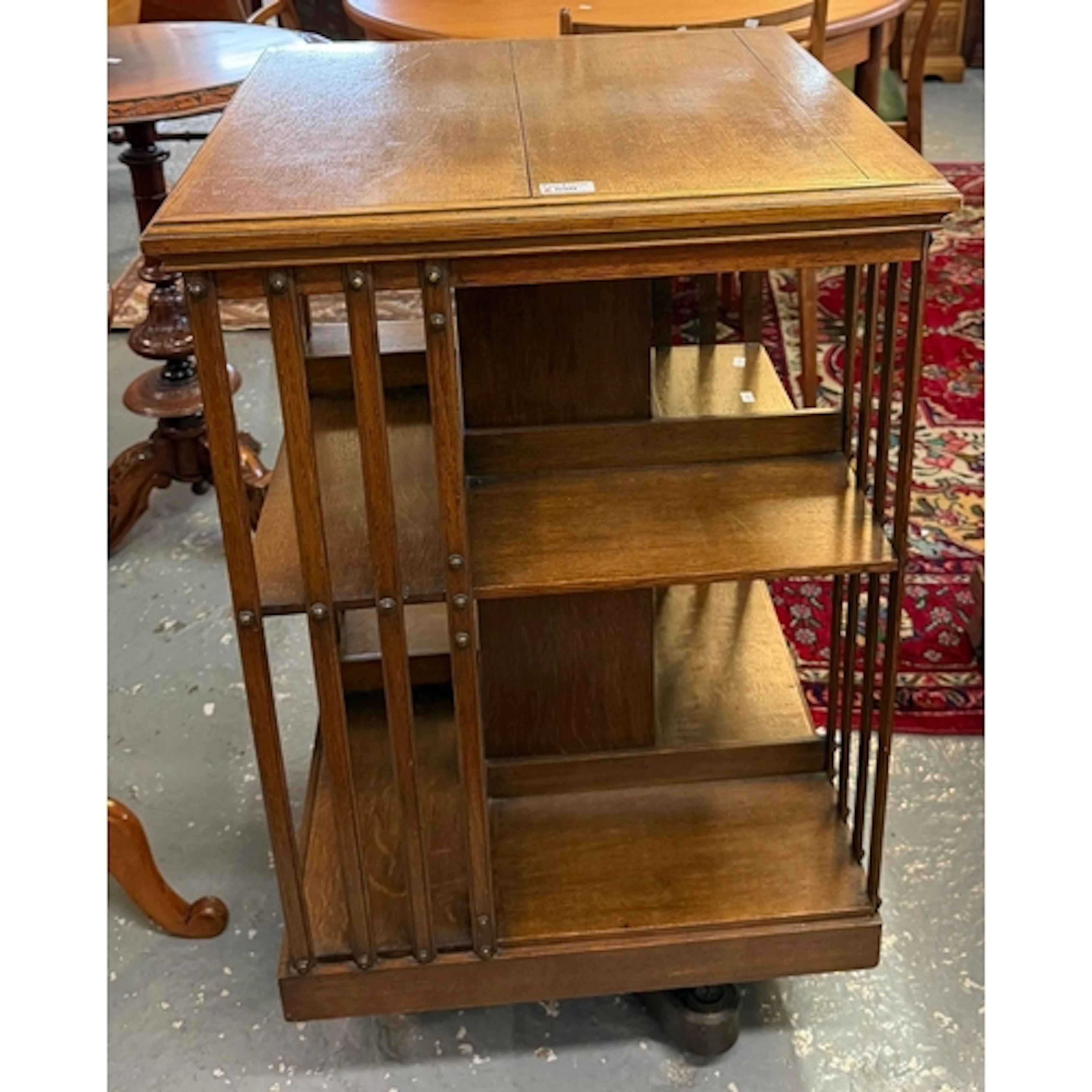 Mid 20th century oak revolving bookcase, with slatted sides ...