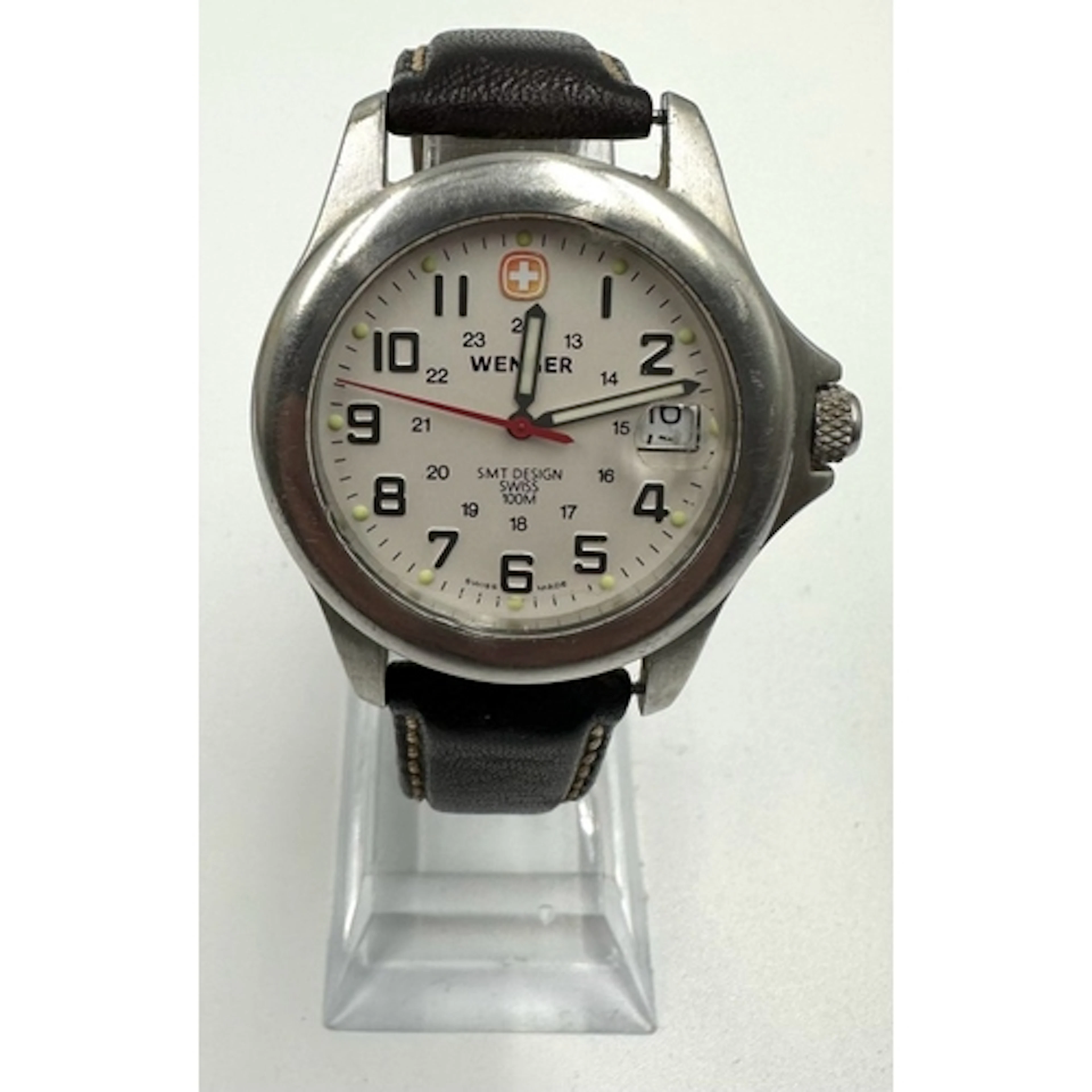 A vintage Wenger Swiss military watch with a white date dial...