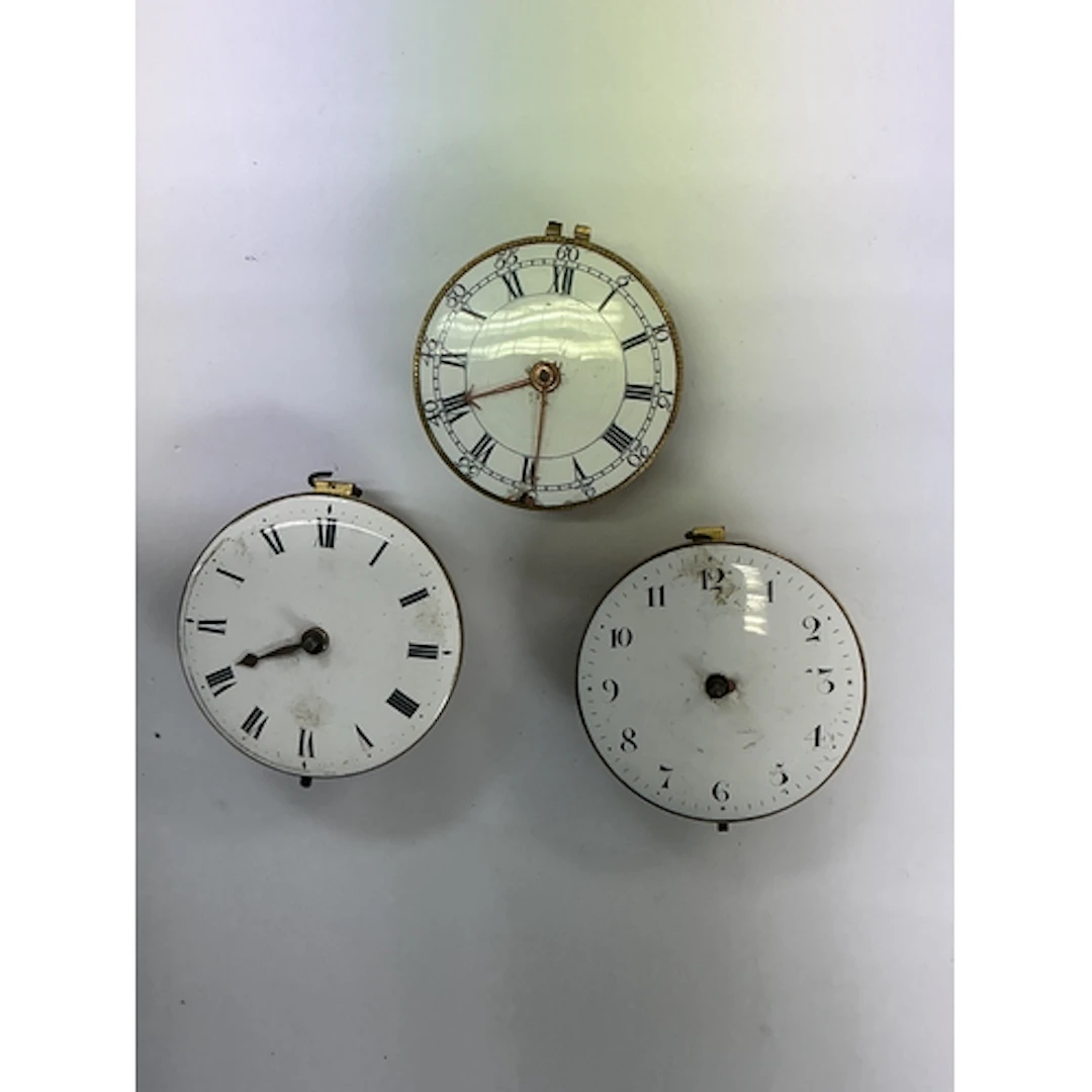 Three 18th century verge watch movements, all having enamel ...