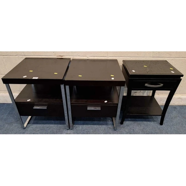 A NEAR PAIR OF LAMP TABLES, raised on chrome legs, united by...