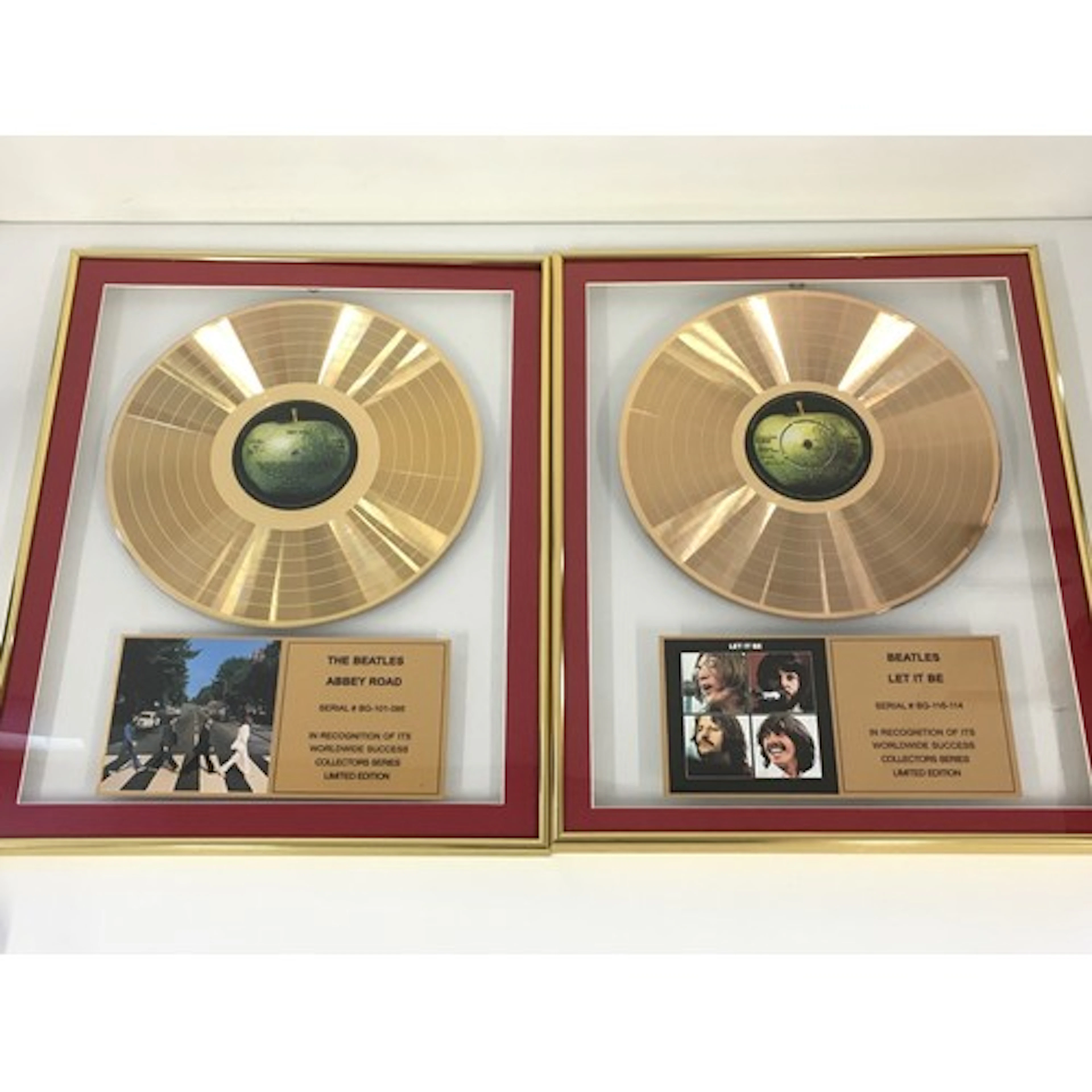 Two framed and limited edition Beatles gold discs comprising...