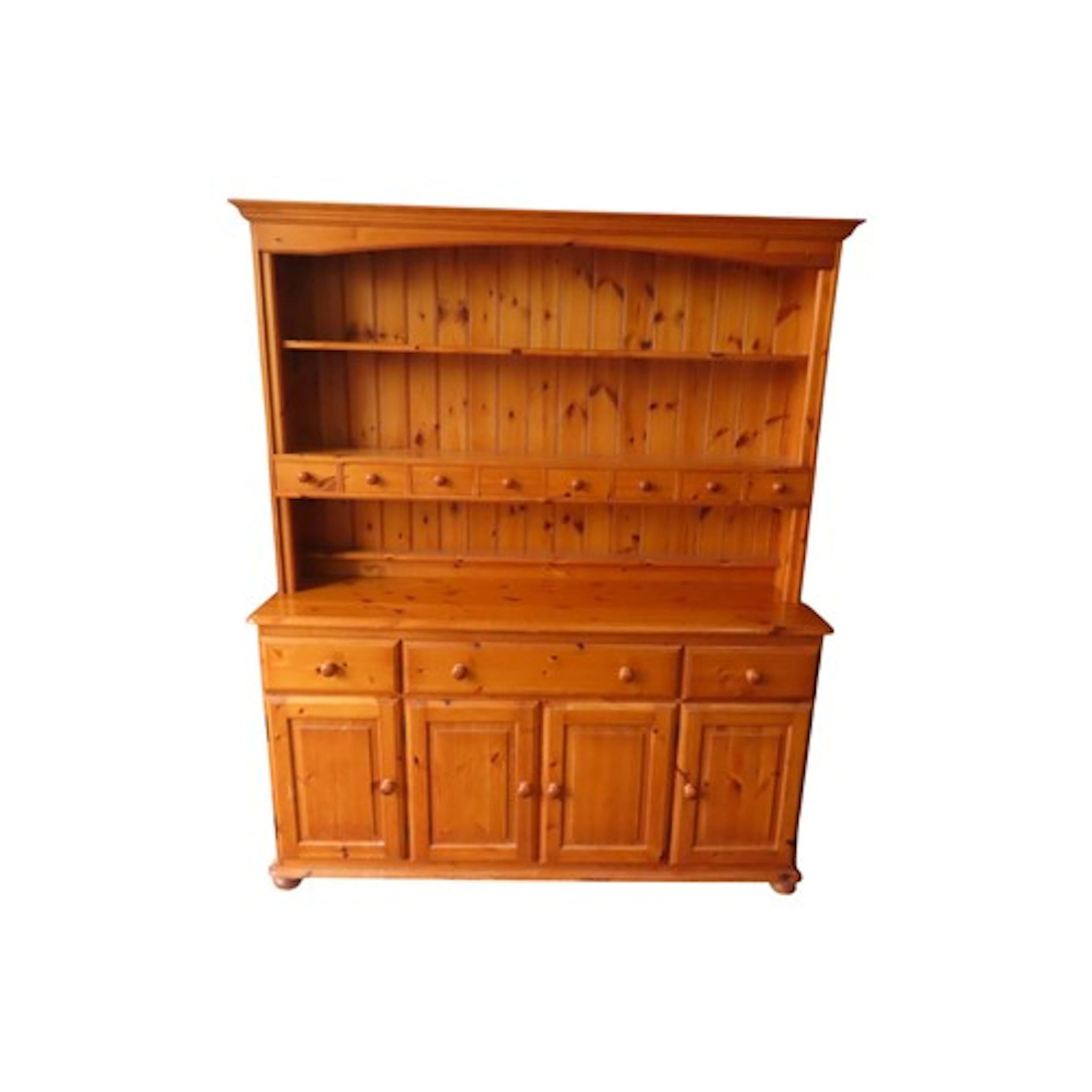 A pine kitchen dresser the base enclosed by four doors and t...
