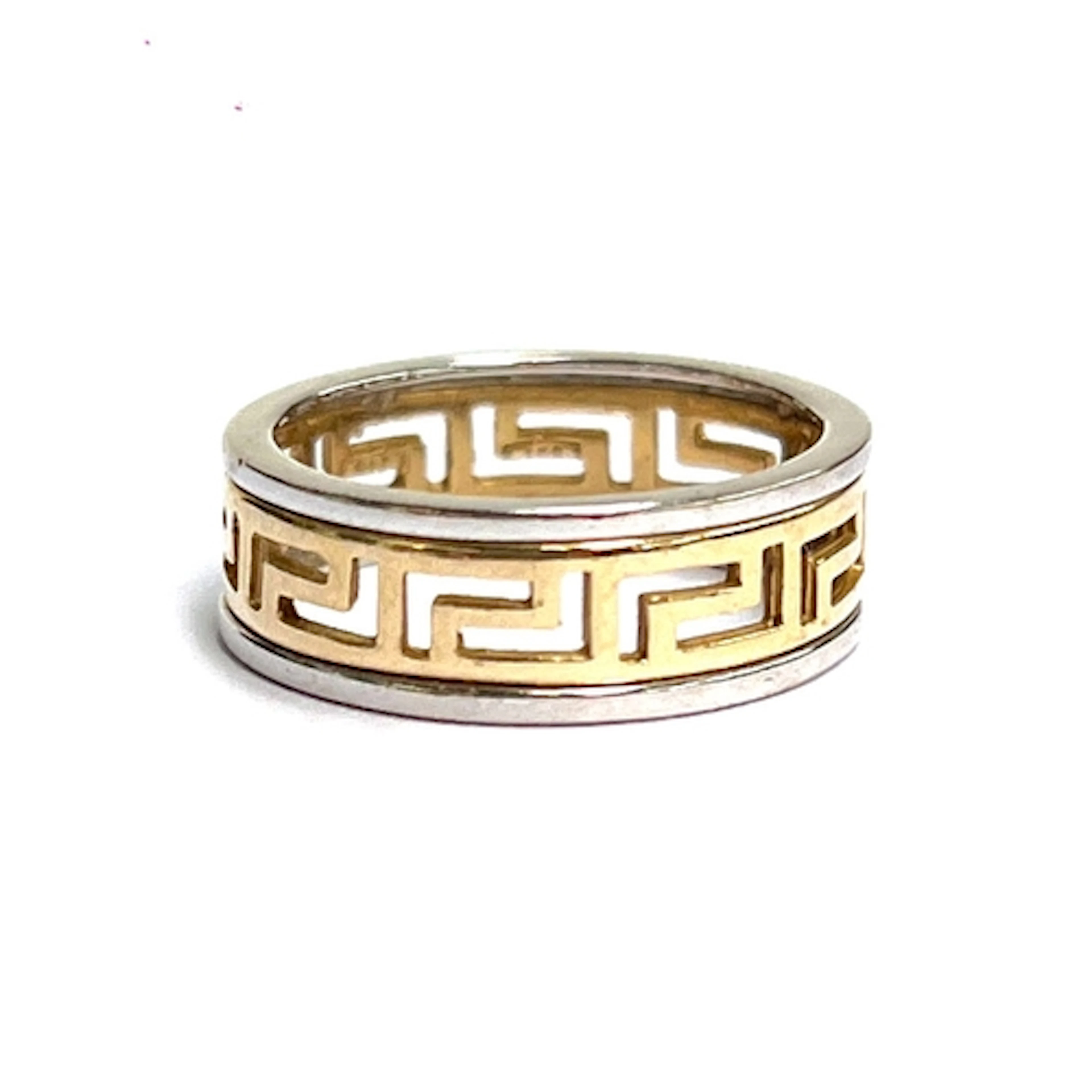 A 14ct yellow and white gold Greek key pattern band, stamped...