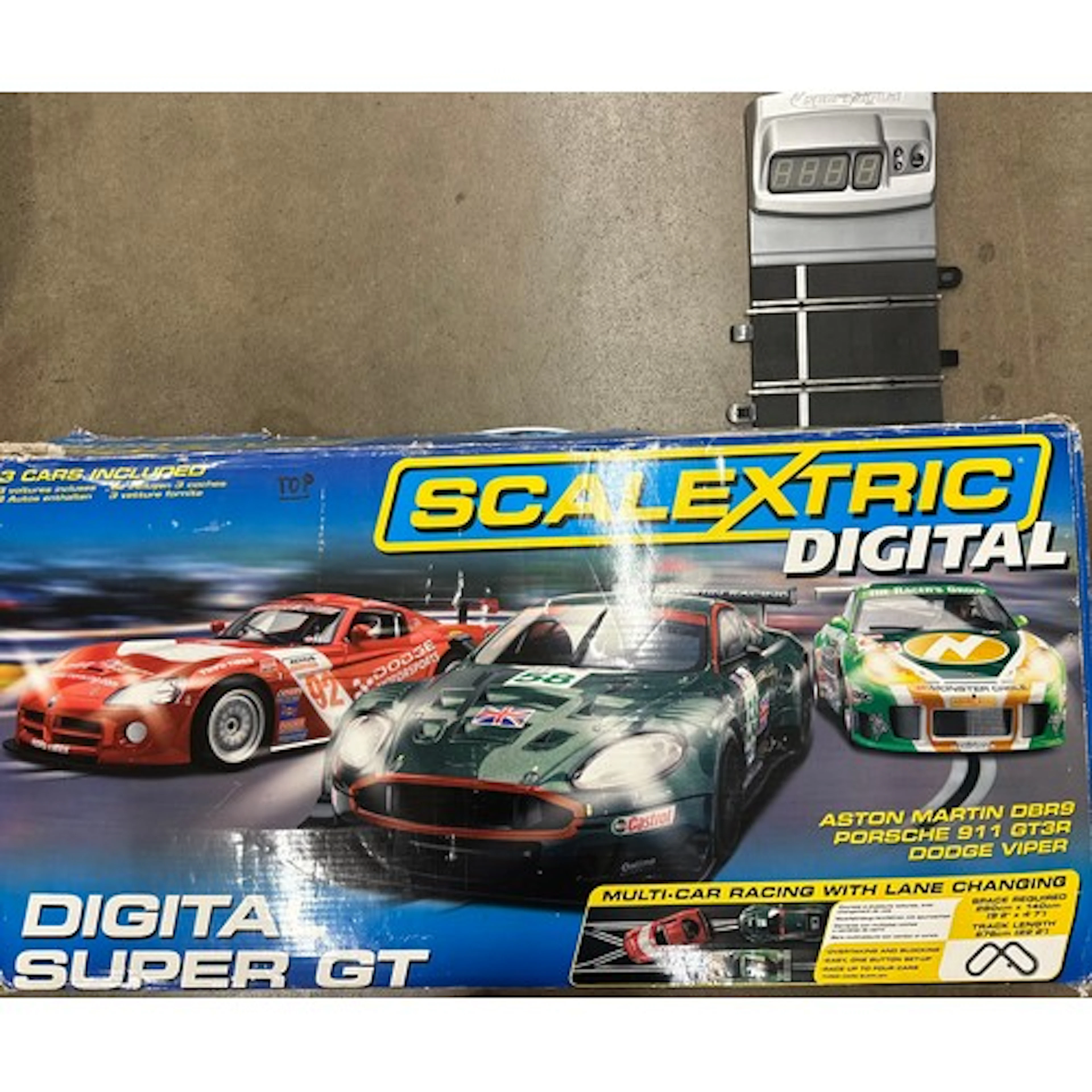 A Scalextric Digital Super GT model racing game with three c...