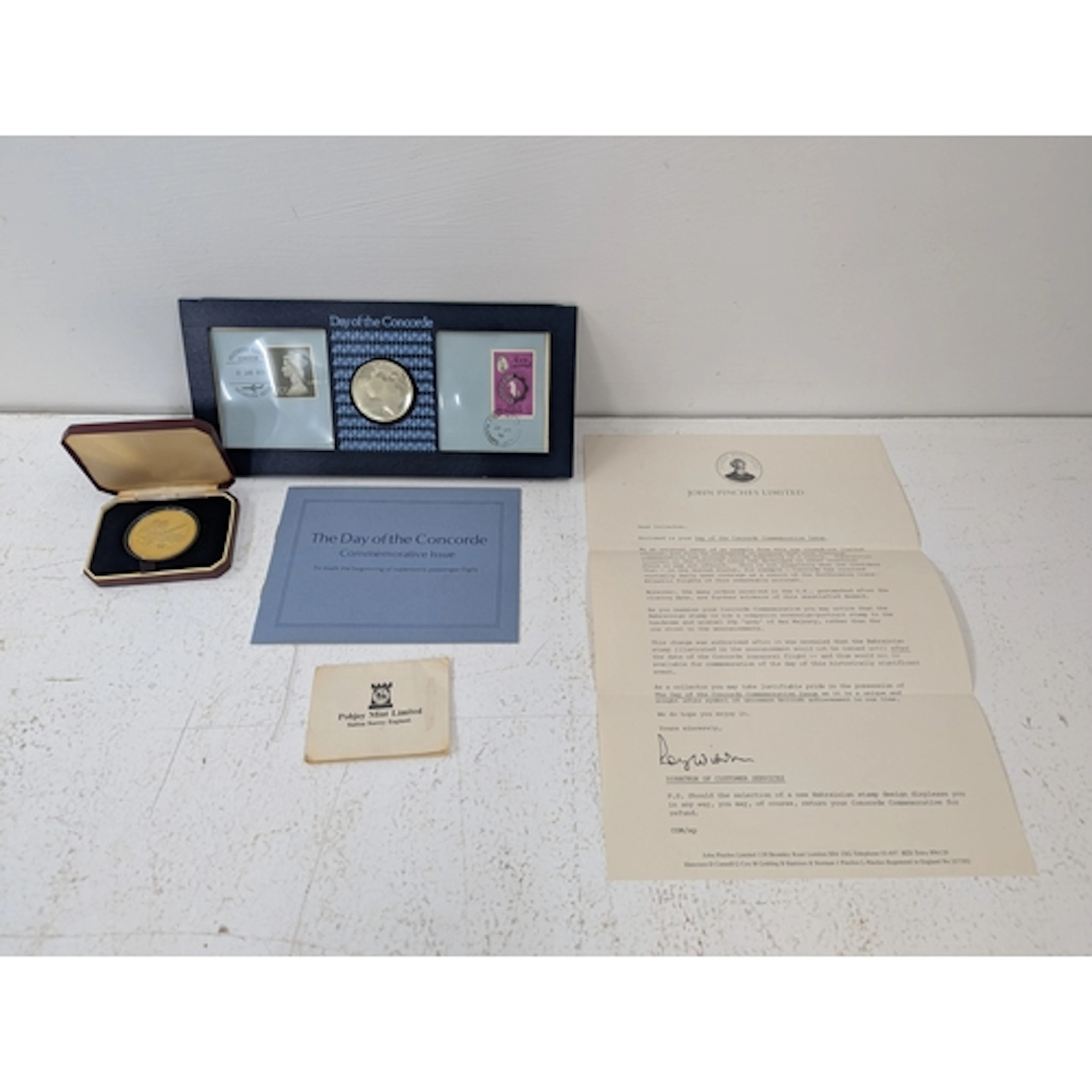 A commemorative Concorde coin, cased to celebrate the first ...