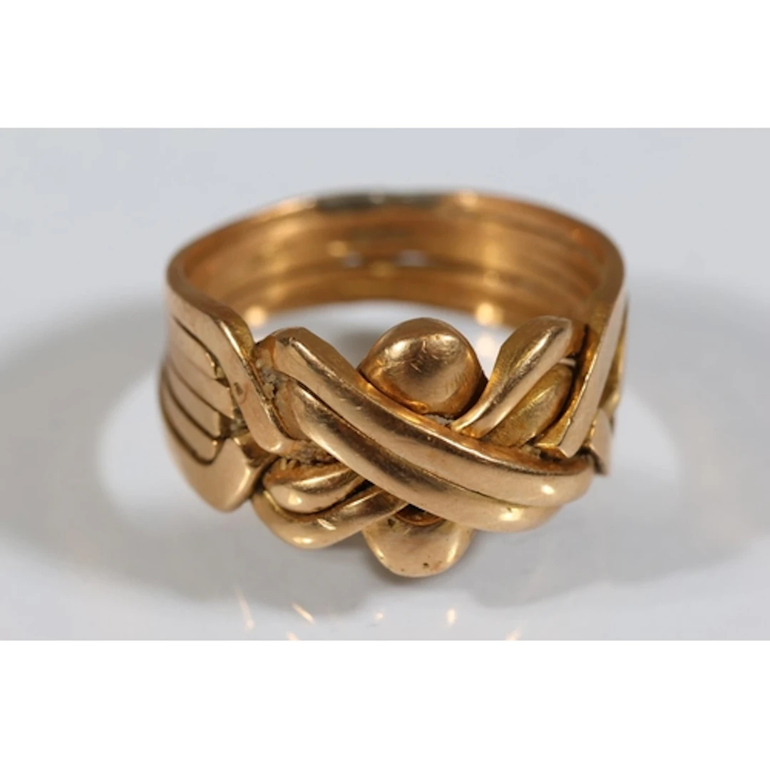 Gold tone puzzle ring, marks indecipherable, size T/U, 11.5g...