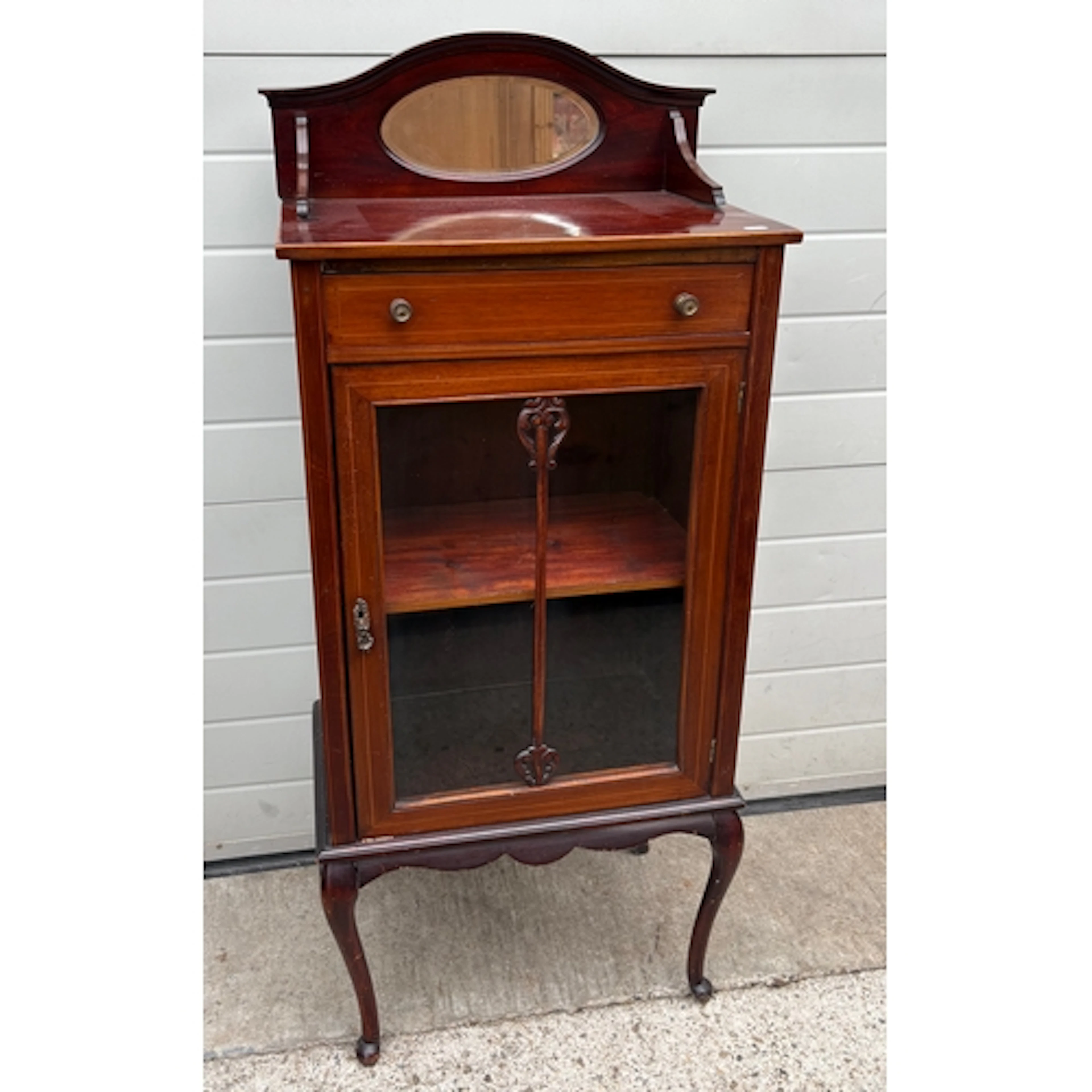An Edwardian mahogany music cabinet