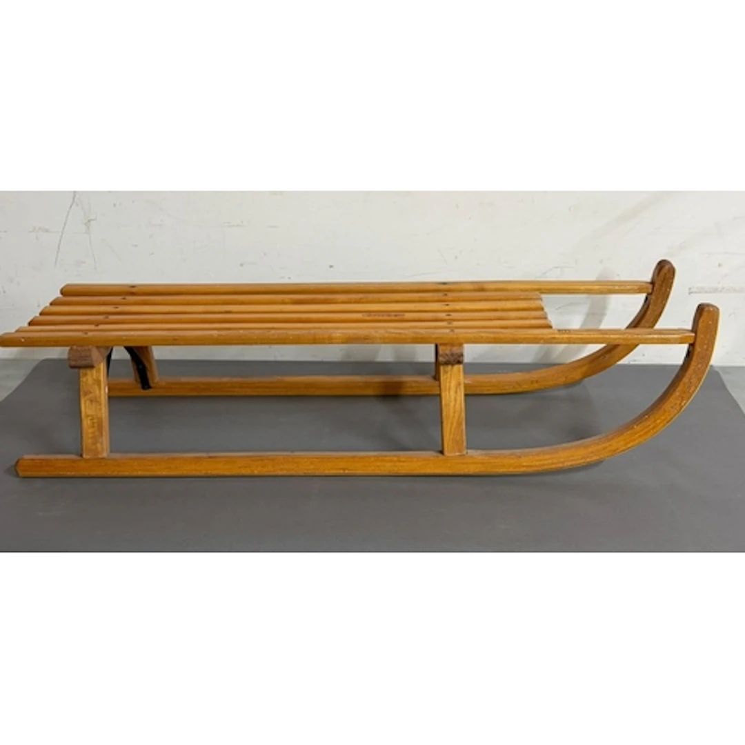 A Wooden sledge or toboggan featuring a slatted wooden seat ...