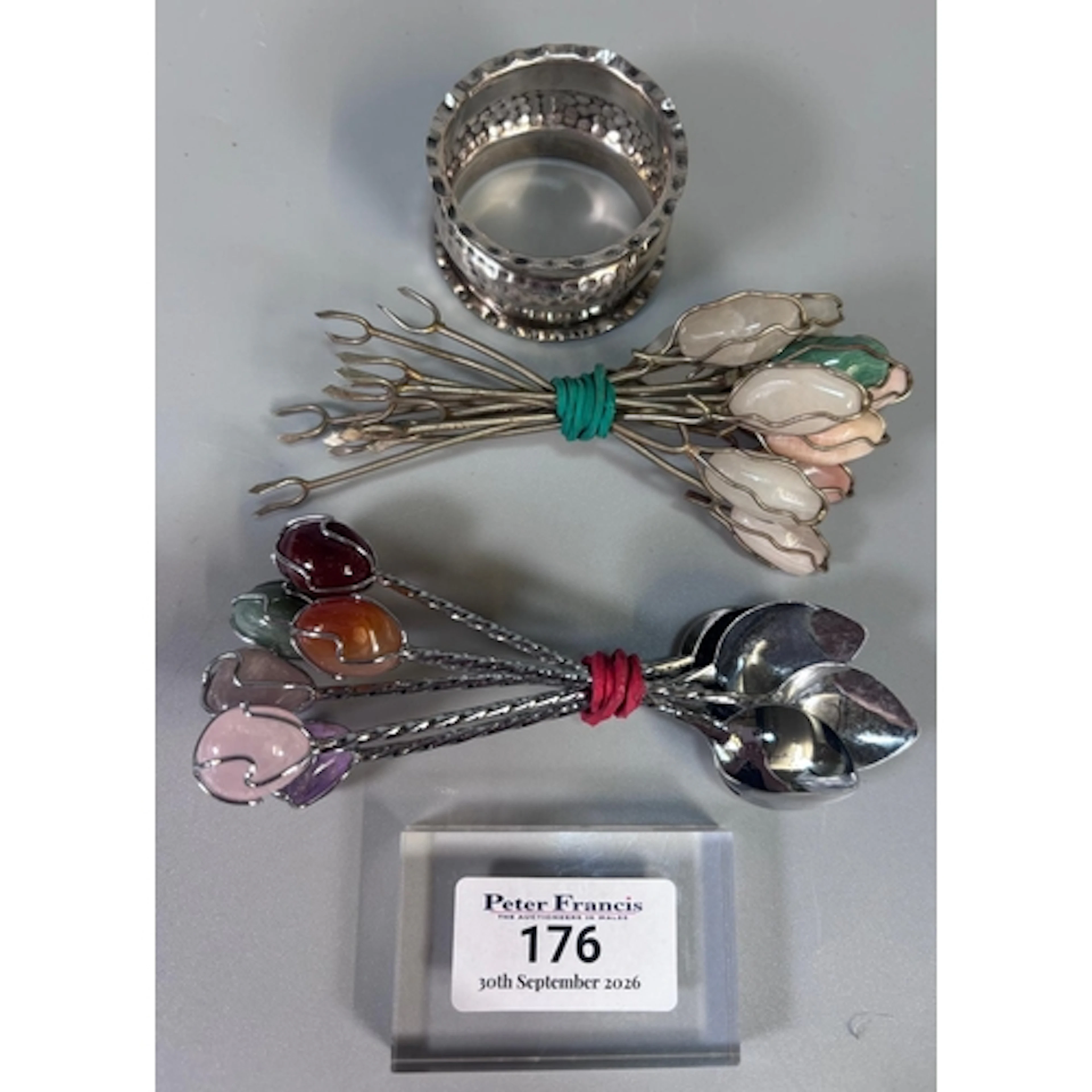 White metal beaten design napkin ring, together with a colle...