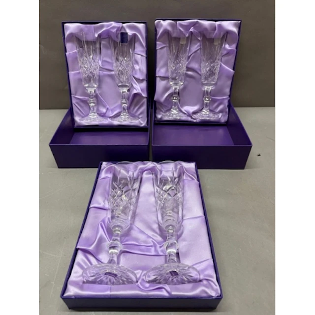 Three boxed sets of Edinburgh crystal glass flutes.