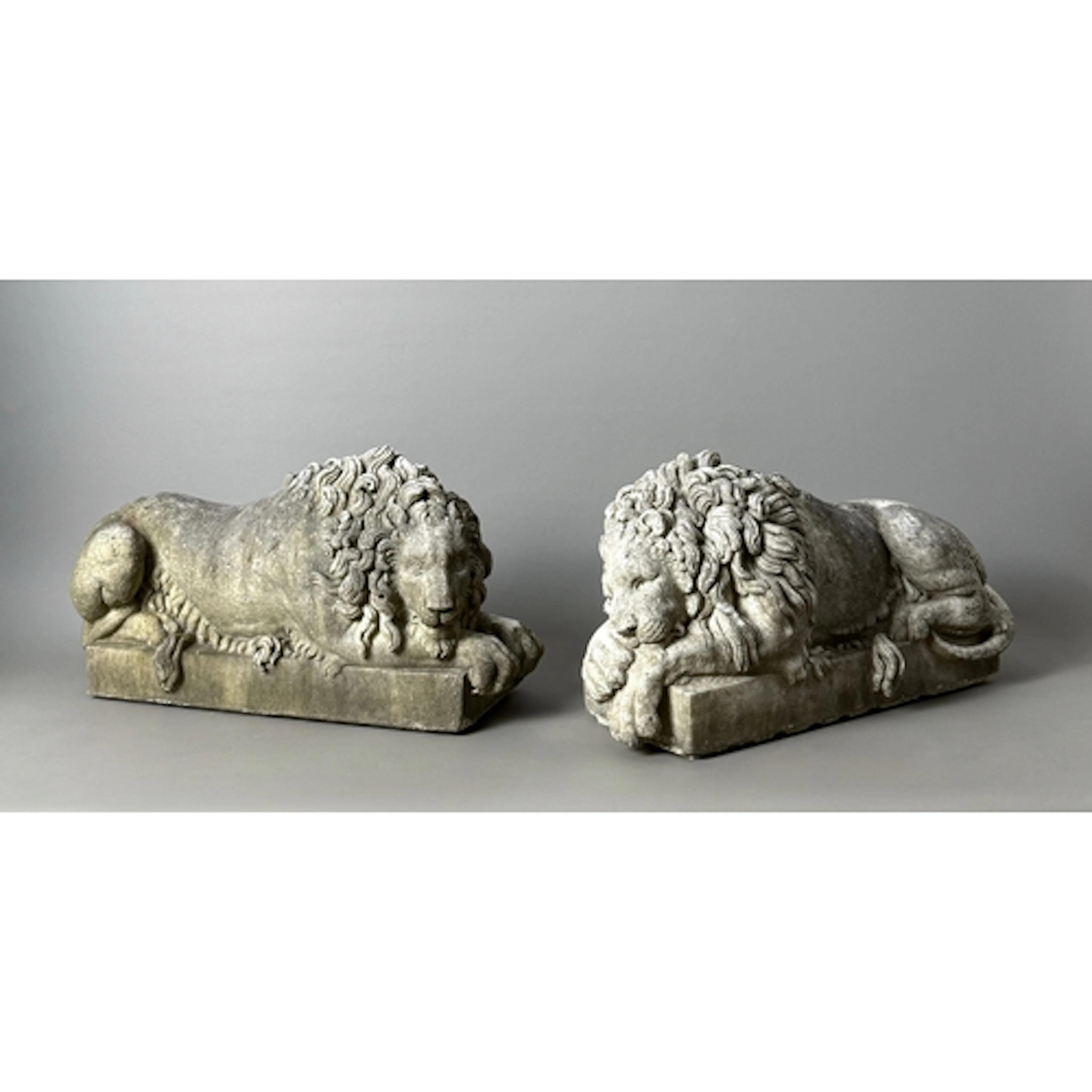A pair of antique carved marble 'Rezzonico' lions after Anto...
