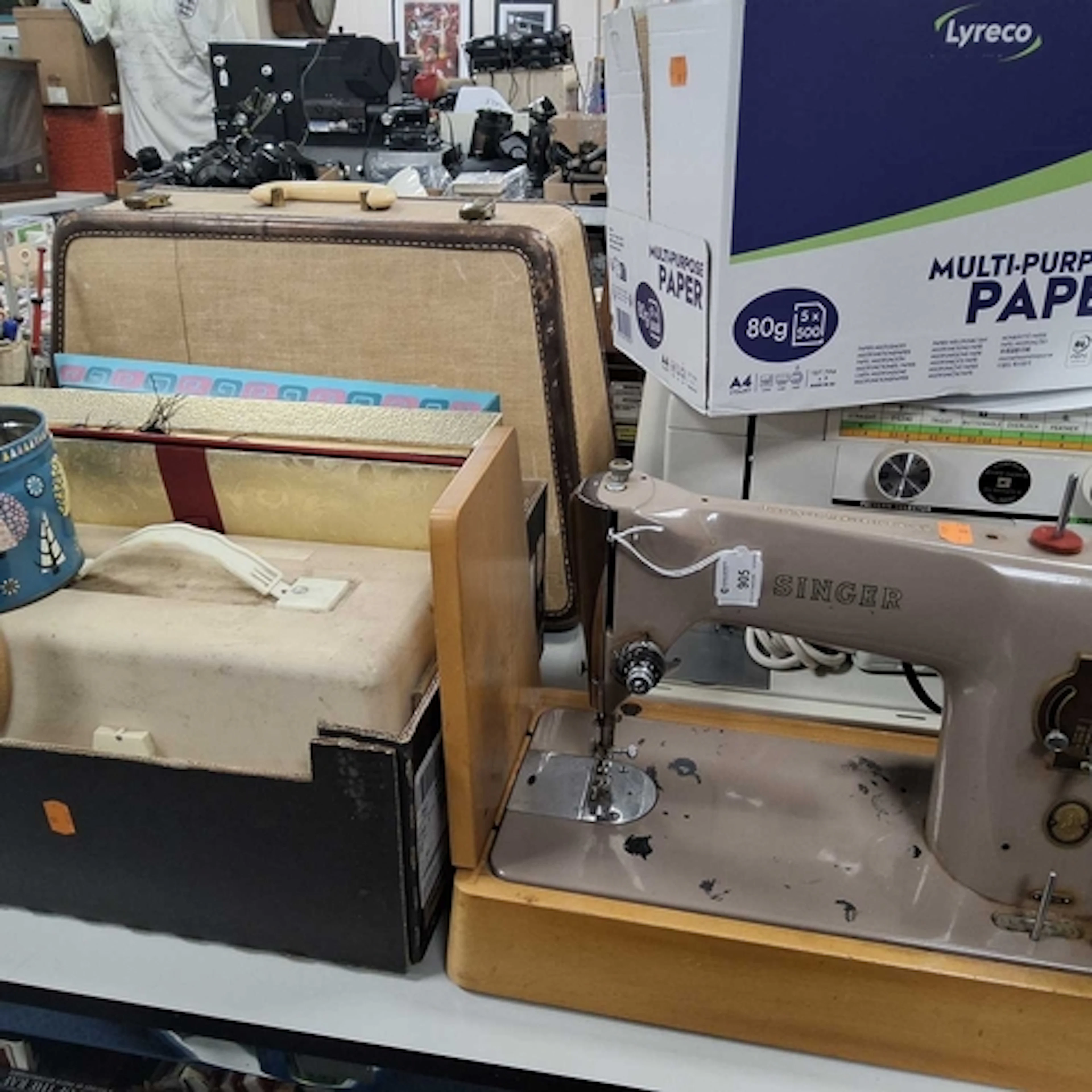 A QUANTITY OF SEWING RELATED ITEMS to include a cased Singer...