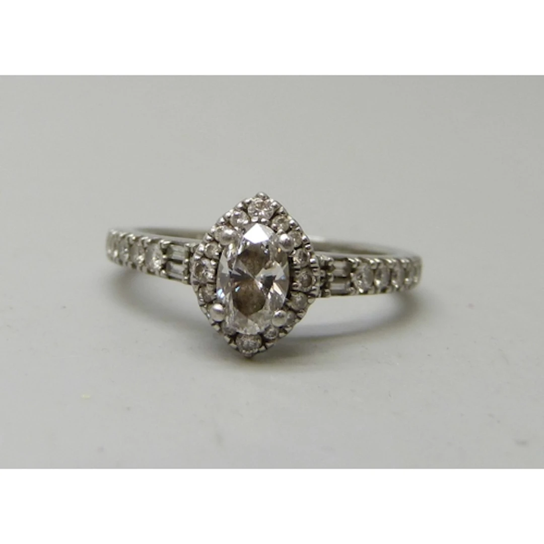 A platinum set diamond cluster ring, with original purchase ...