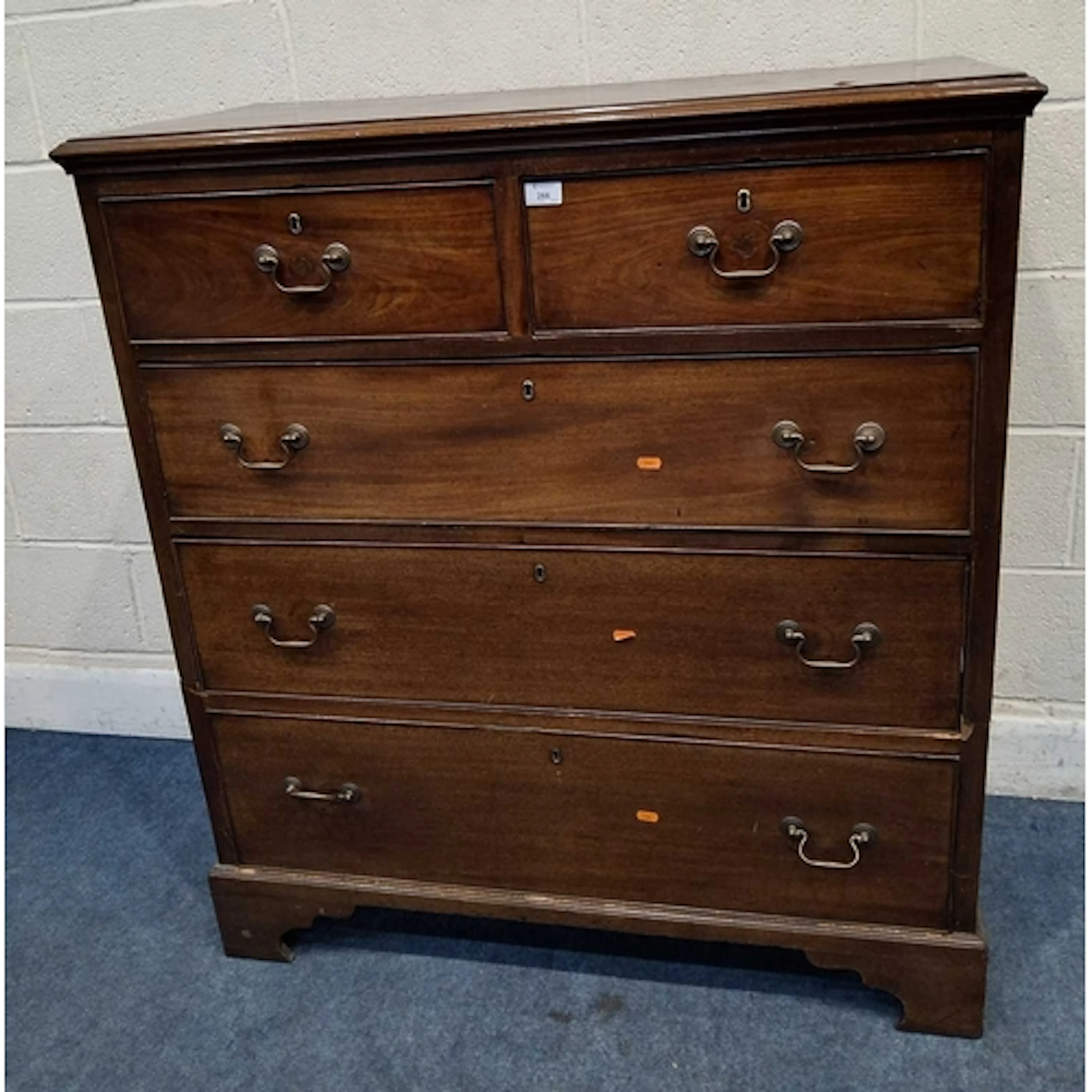 A GEORGIAN MAHOGANY CHEST OF TWO SHORT OVER THREE LONG DRAWE...