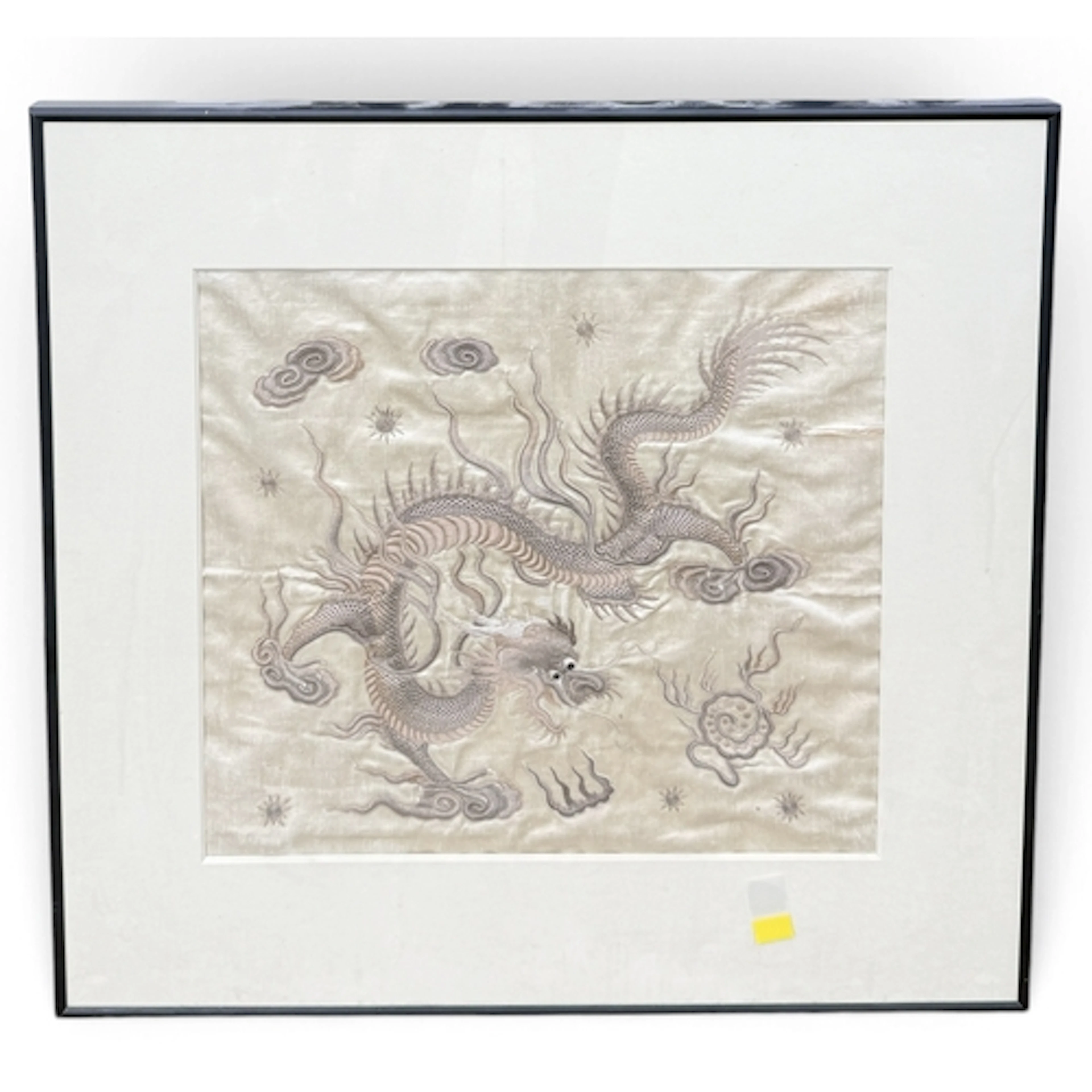 A CHINESE SILK EMBROIDERY OF A DRAGON CHASING THE FLAMING PE...