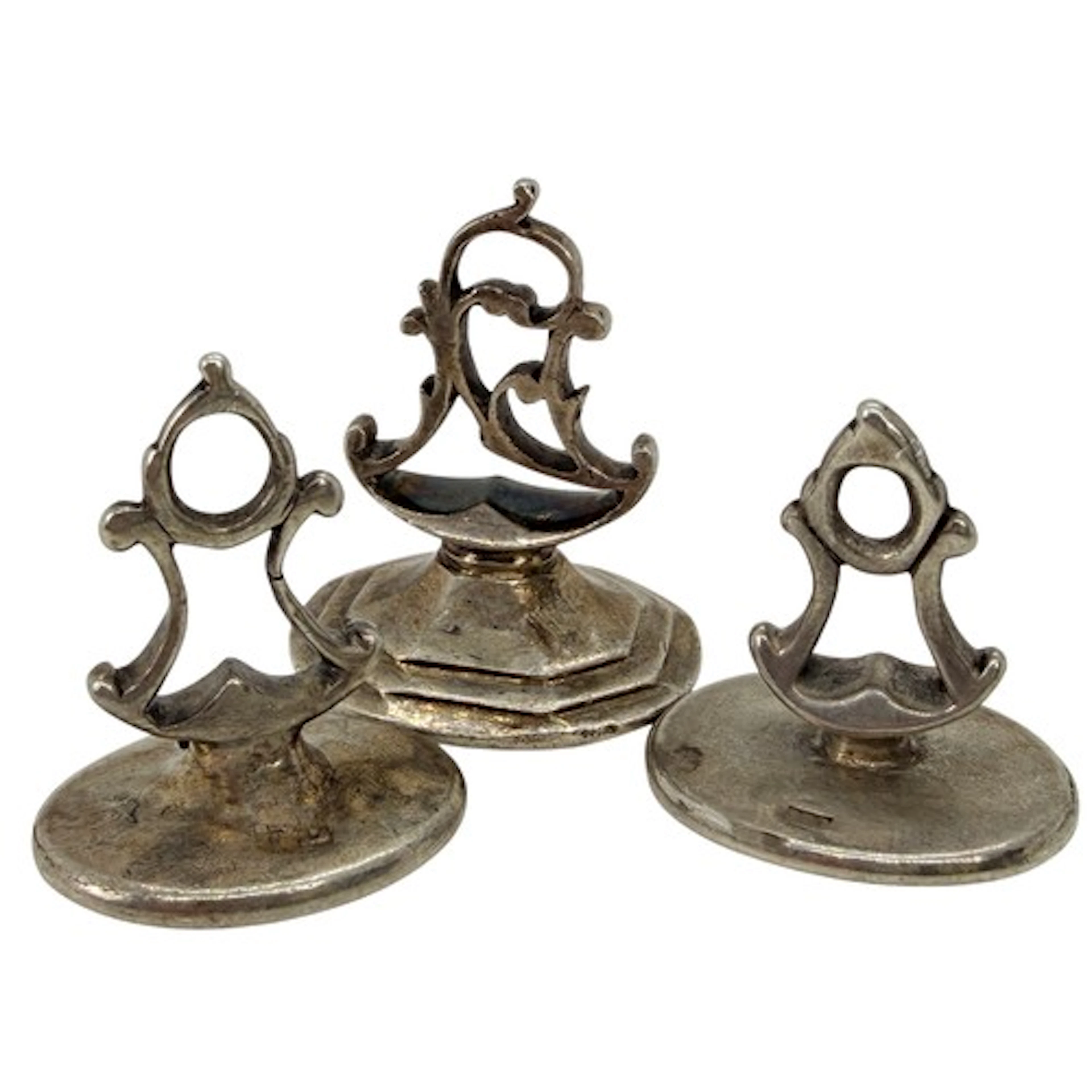 Three English silver fob seals of oval form, the first engra...
