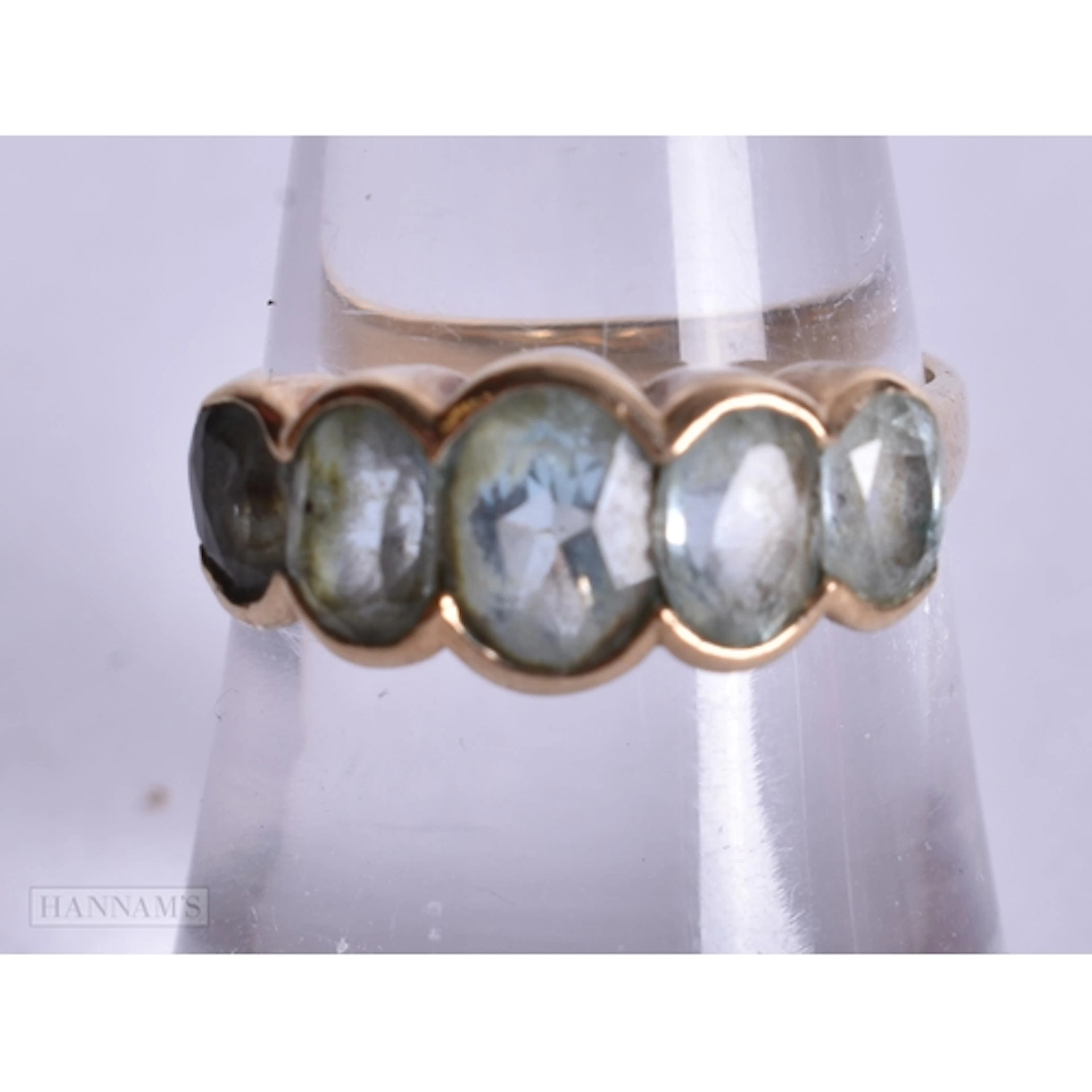 A 9CT GOLD BLUE ZIRCON RING. 3 grams. M.