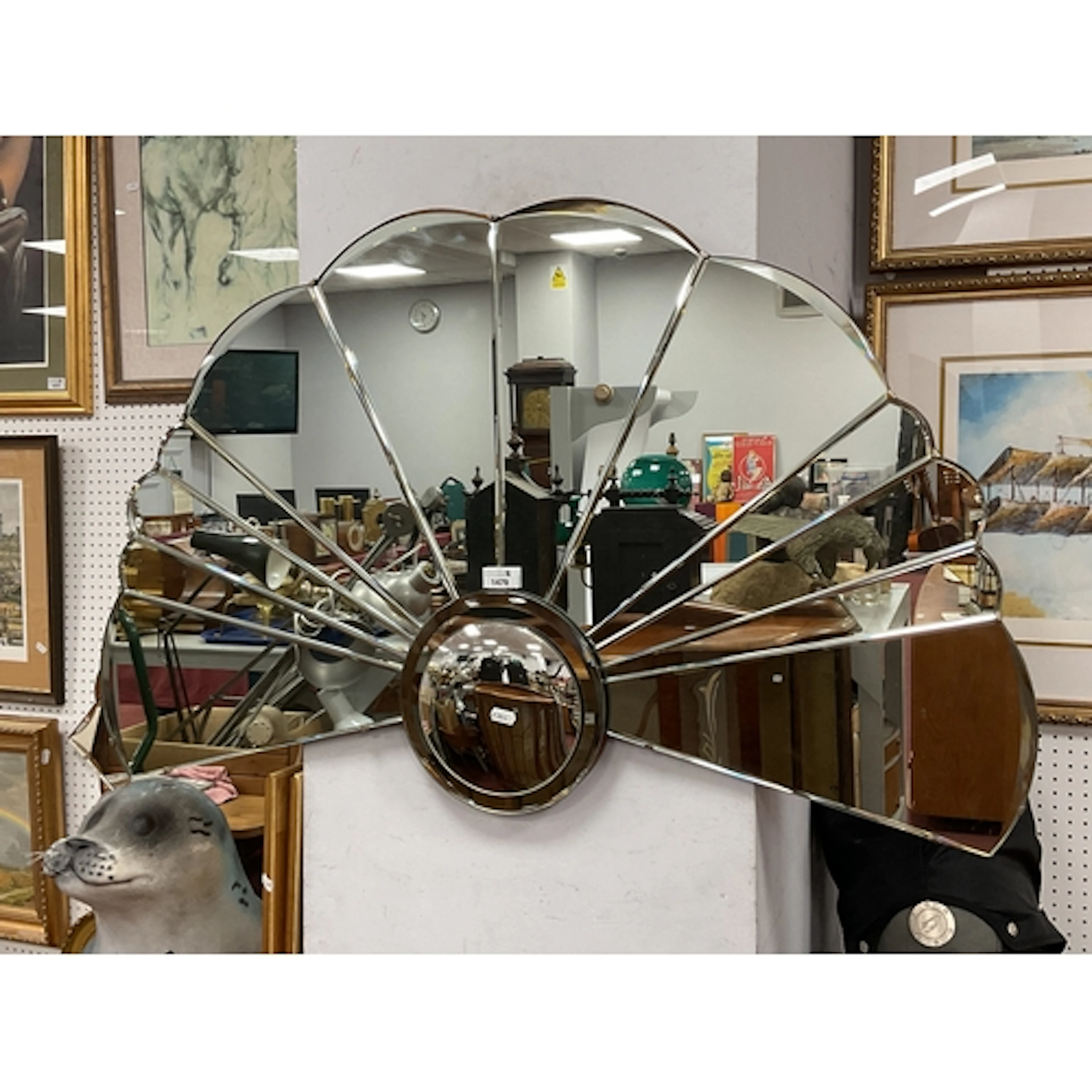 An Art Deco-Style Fan-Shaped Wall Mirror, with segmented pan...