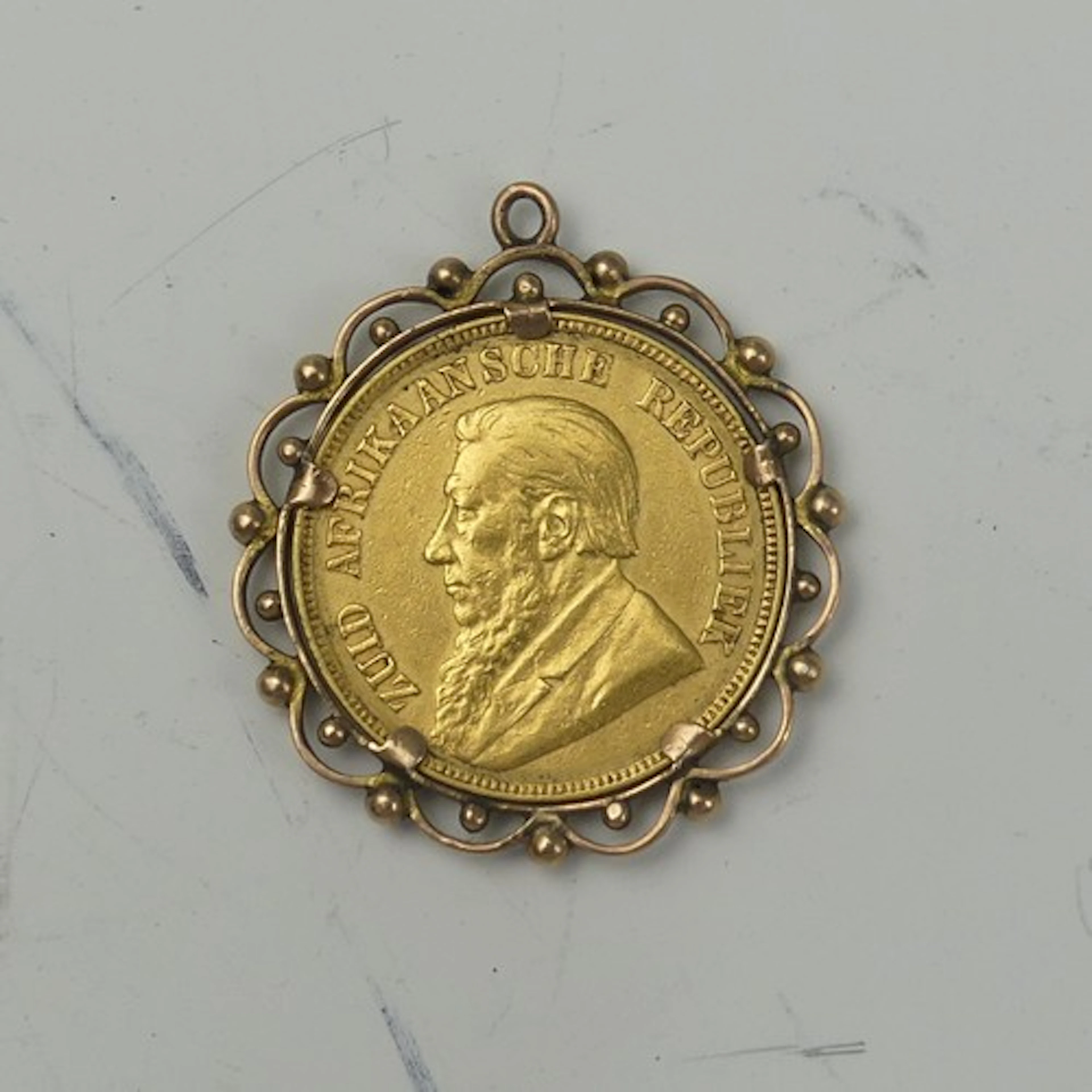 A South African gold 1 Pond Coin, dated 1898, in unmarked pe...
