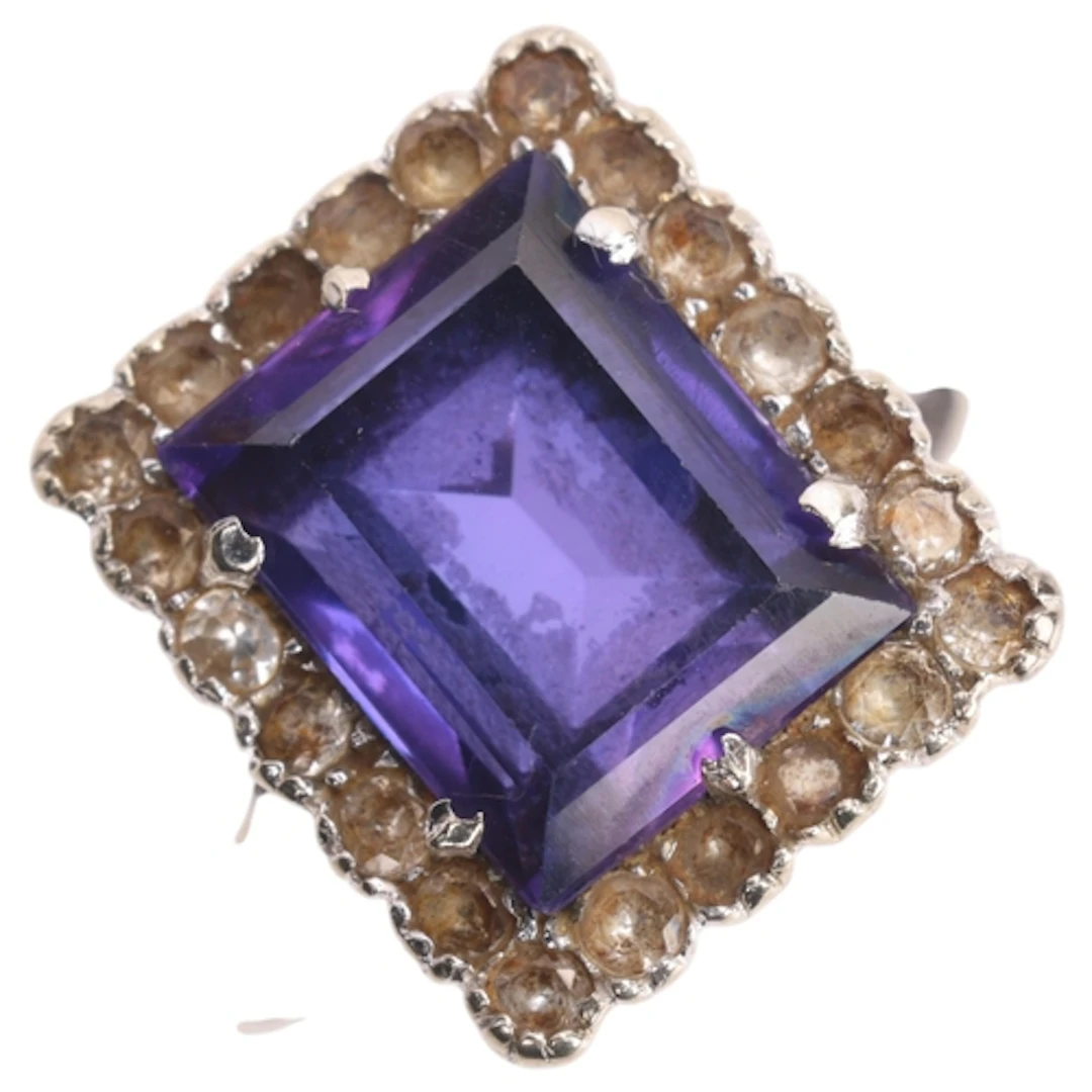 An 18ct white gold purple synthetic sapphire and sapphire cl...