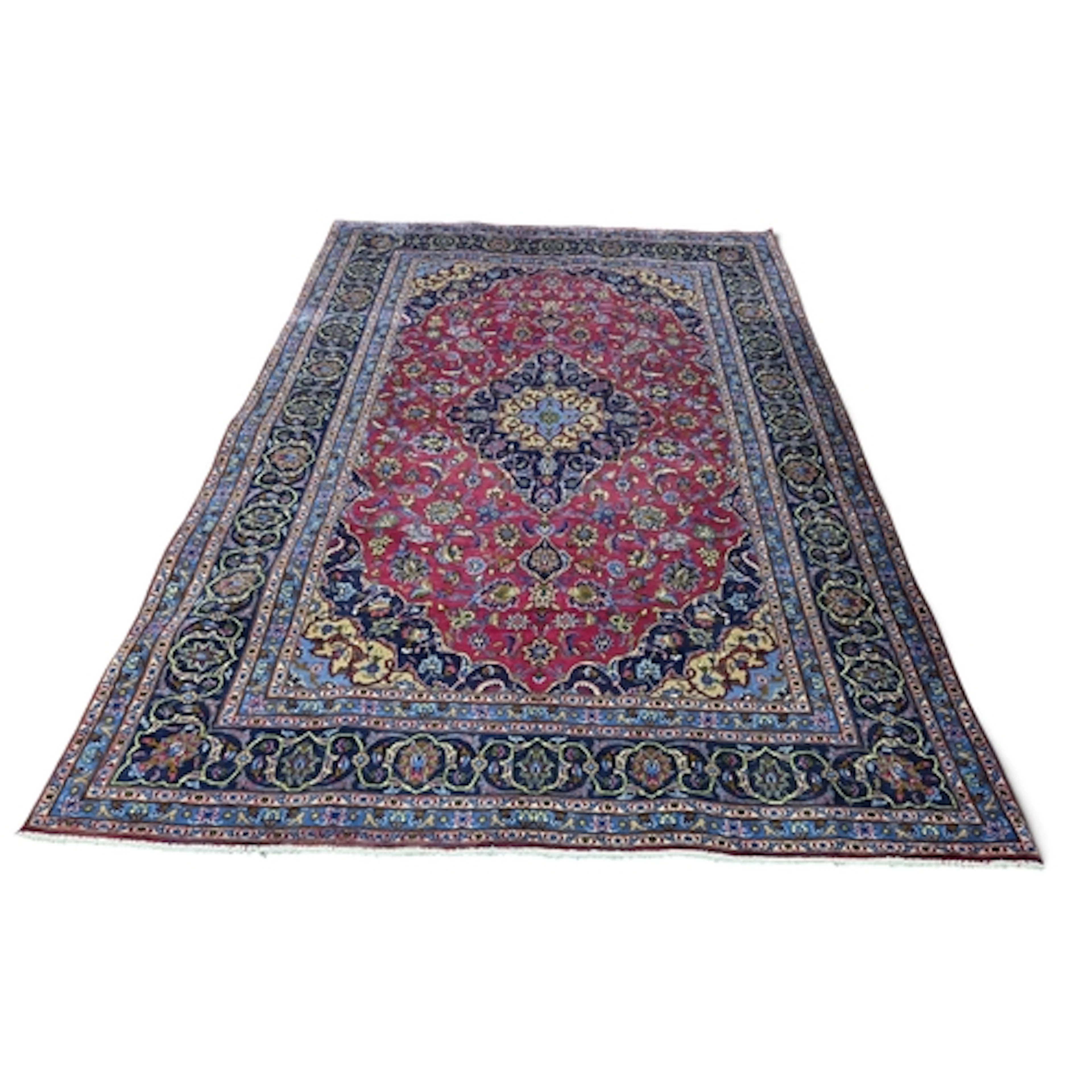 A rich Red ground full pile hand woven Persian Kashan Carpet...