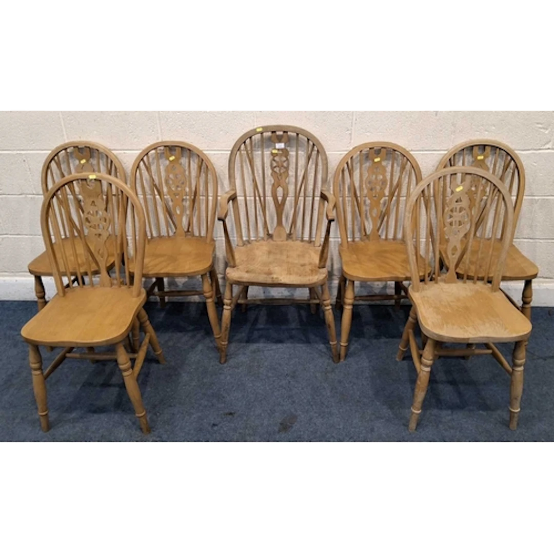 A SET OF SIX BEECH WHEEL BACK CHAIRS, along with a similar c...