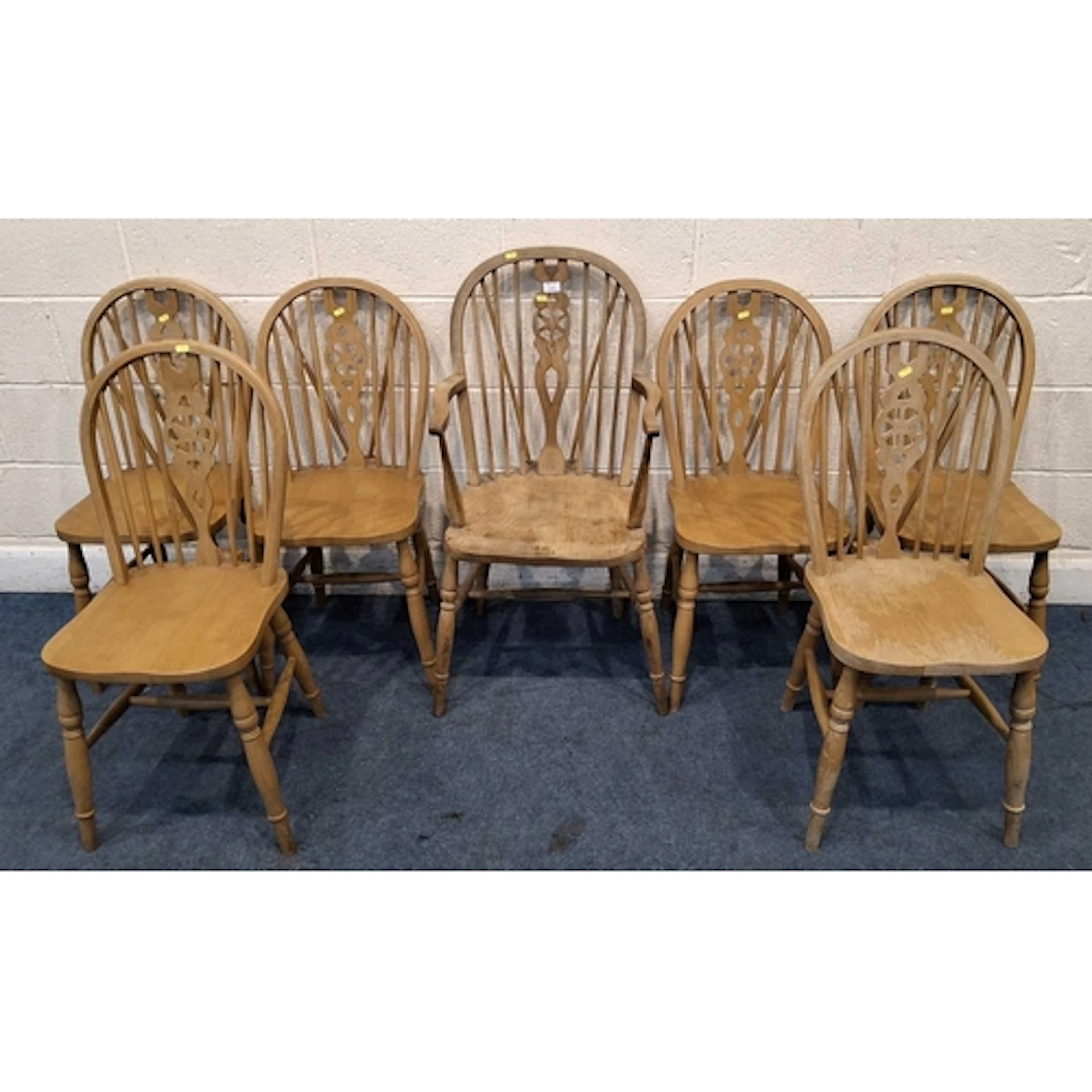 A SET OF SIX BEECH WHEEL BACK CHAIRS, along with a similar c...
