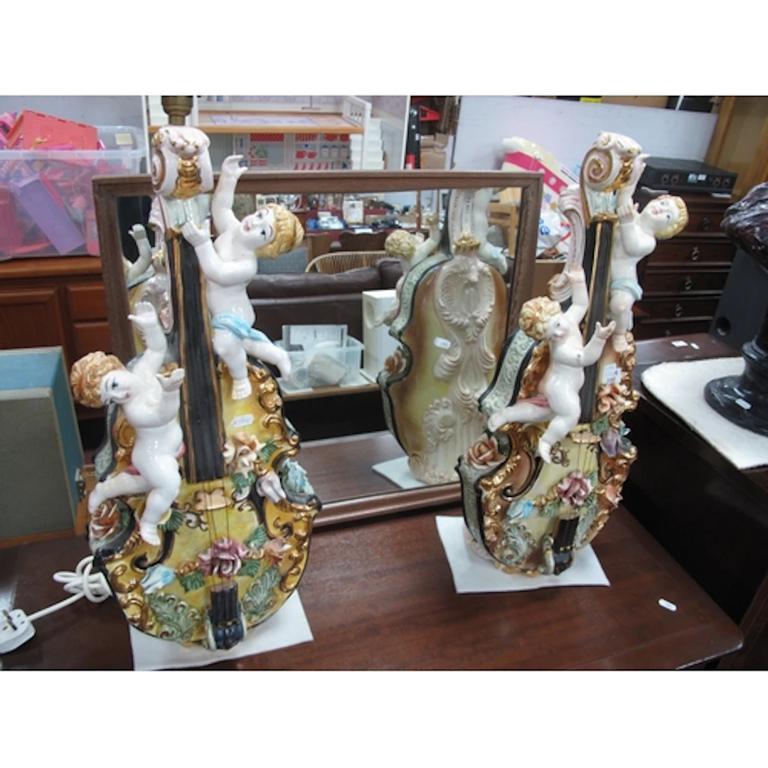 A Pair of Italian Ceramic Table Lamps, each as a violin with...