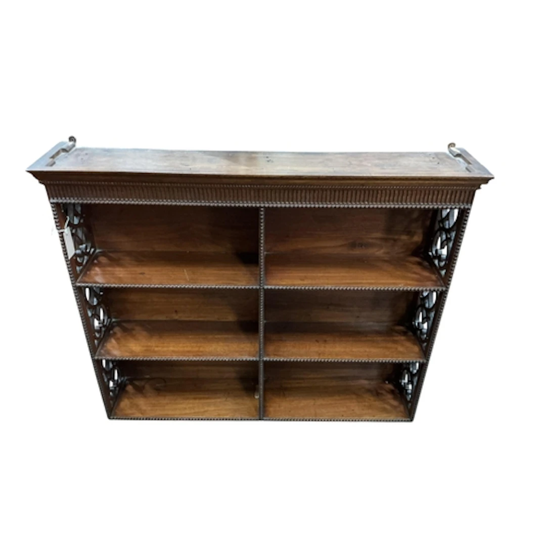 An early Victorian hanging bookcase with fret pierced sides ...