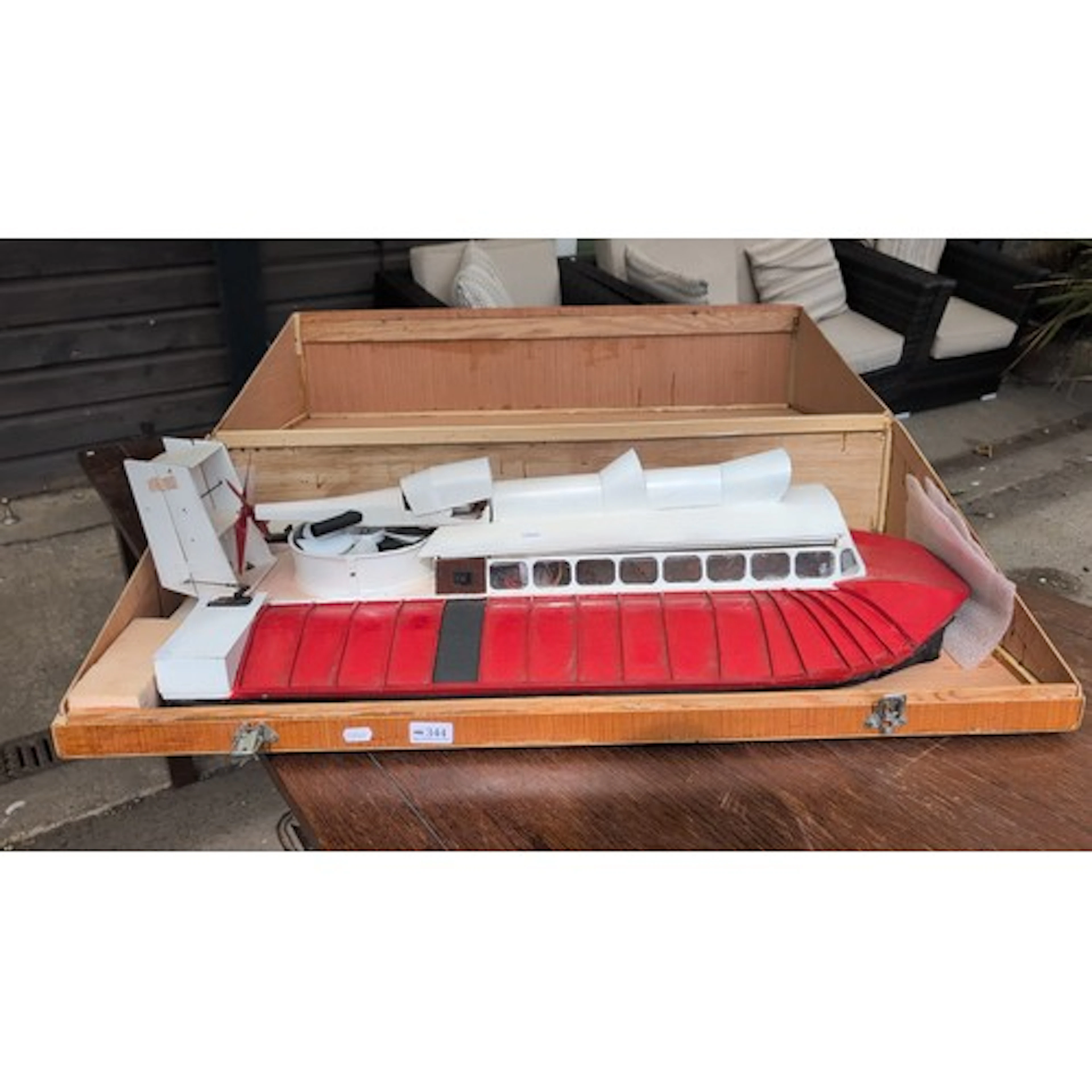 Large radio-controlled hovercraft model, the red and white h...