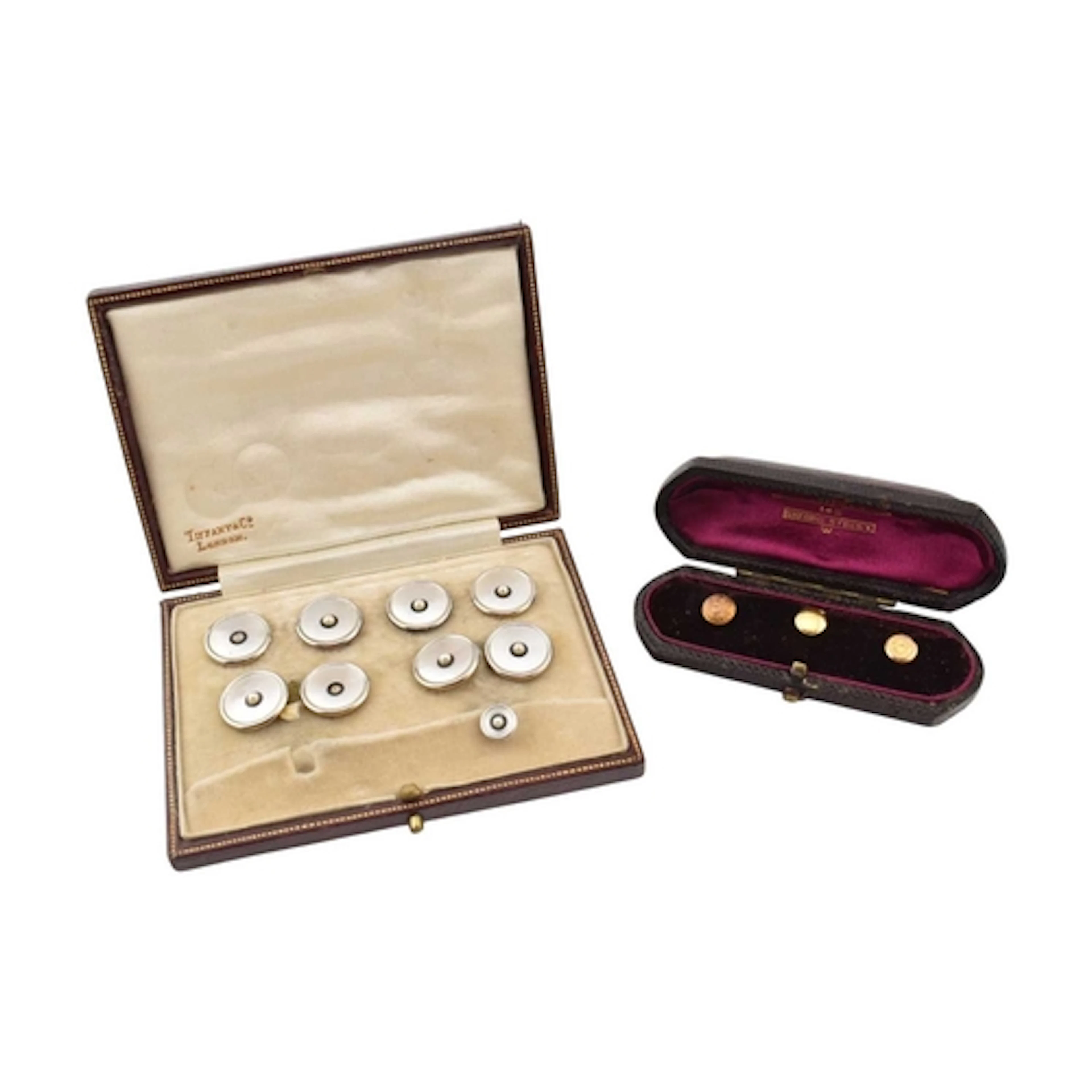 An 18ct gold and platinum dress set to include four buttons,...