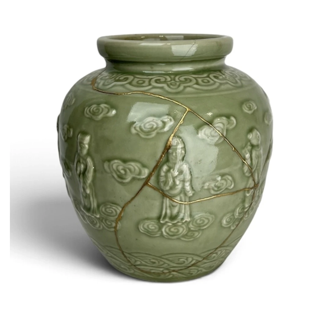 A CHINESE QING PERIOD KINTSUGI CELADON JAR Inscribed to base...