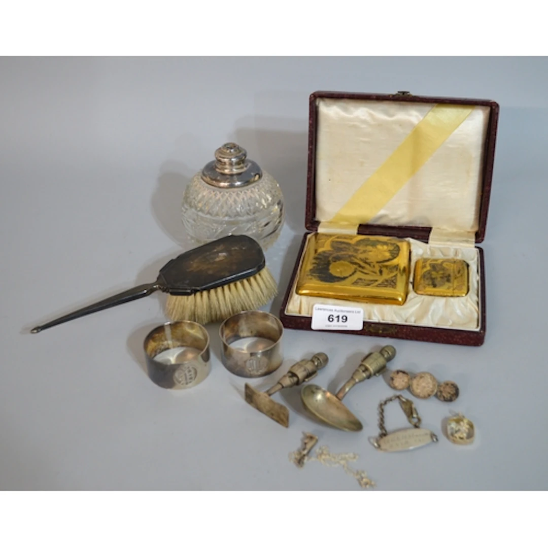 Two silver napkin rings, small silver backed hand brush, cas...