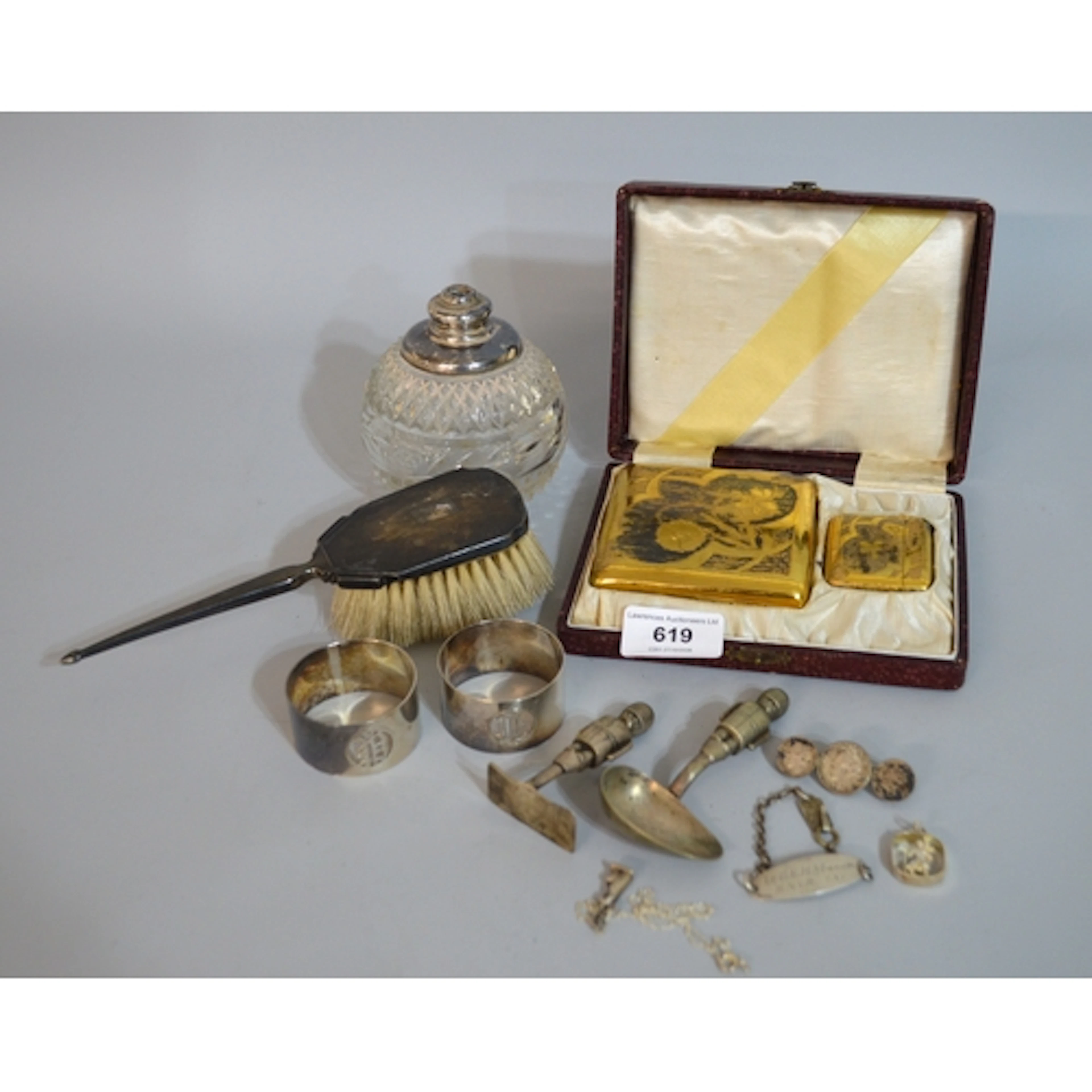 Two silver napkin rings, small silver backed hand brush, cas...