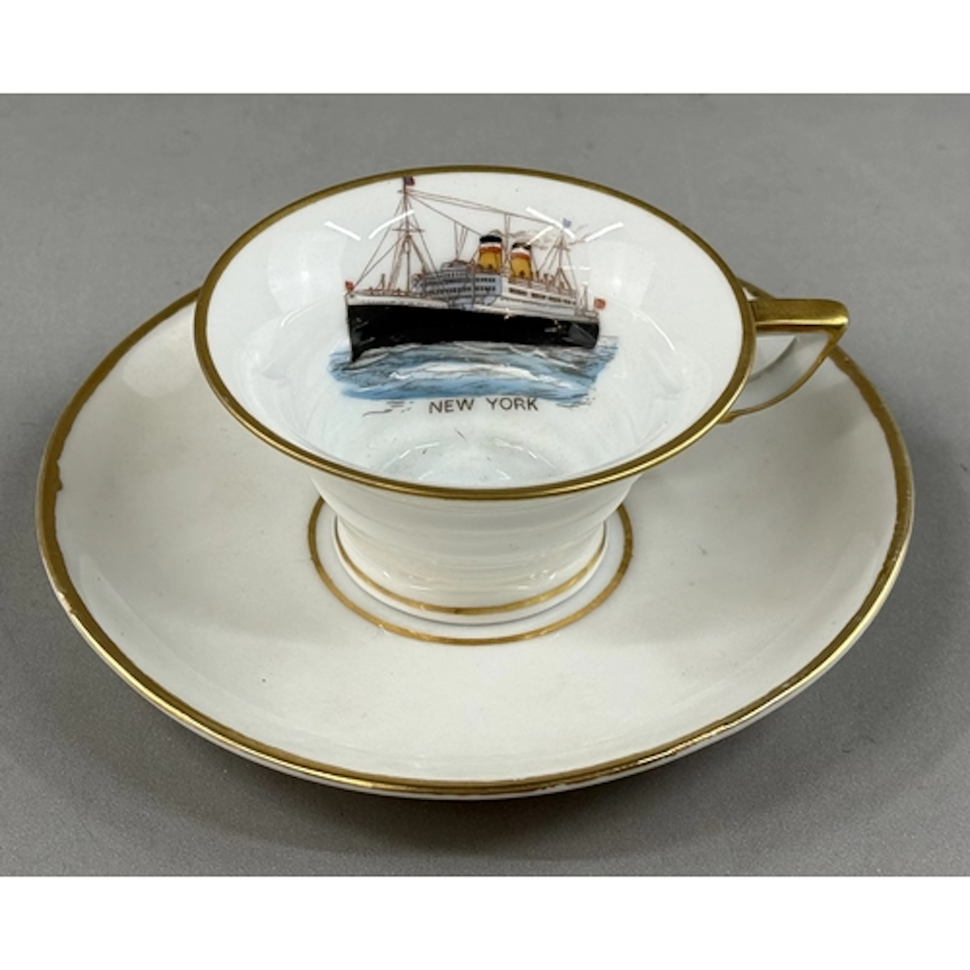 Maritime: a Volkstedt cup and saucer transfer printed with t...