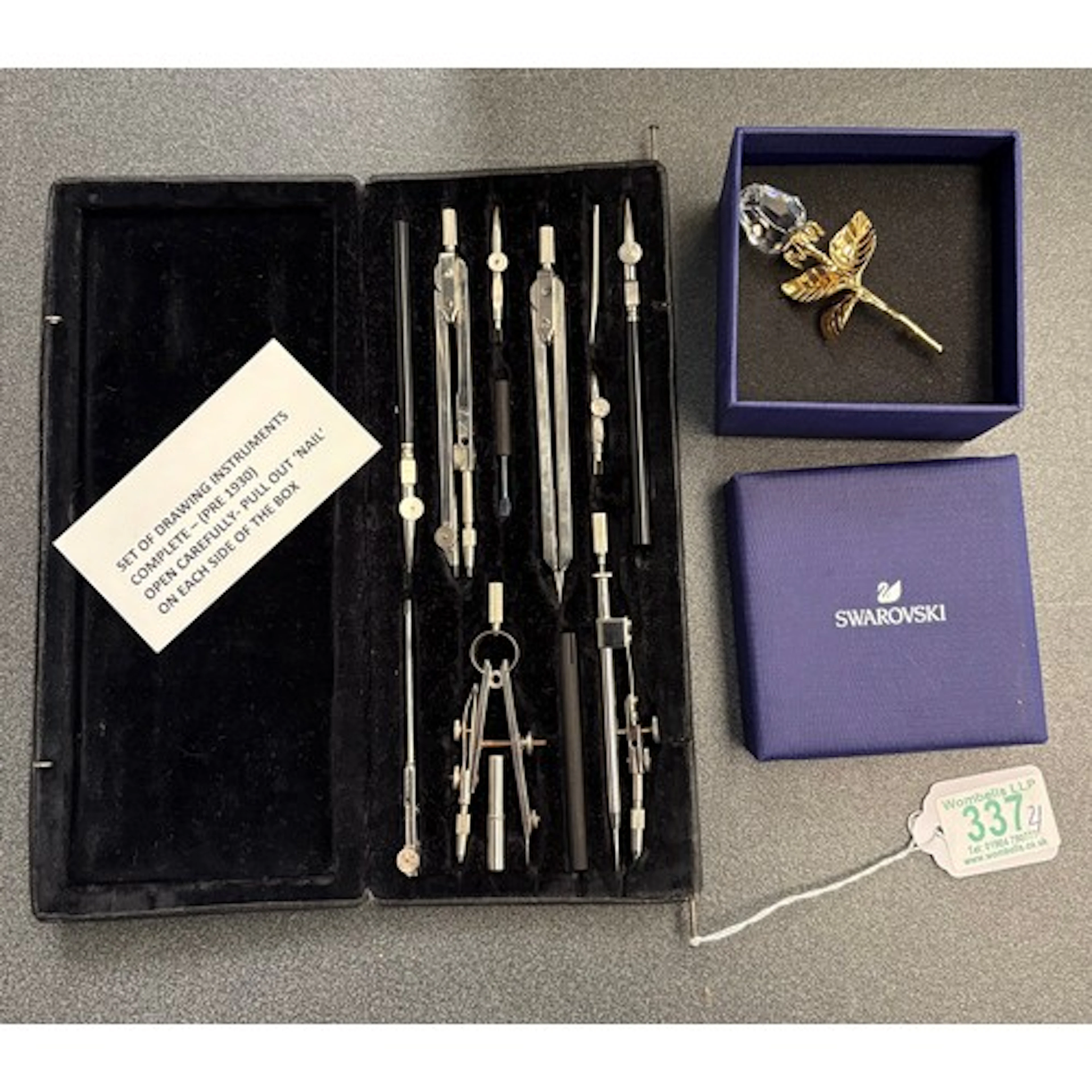 A Swarovski Rose bud brooch together with a cased drawing se...