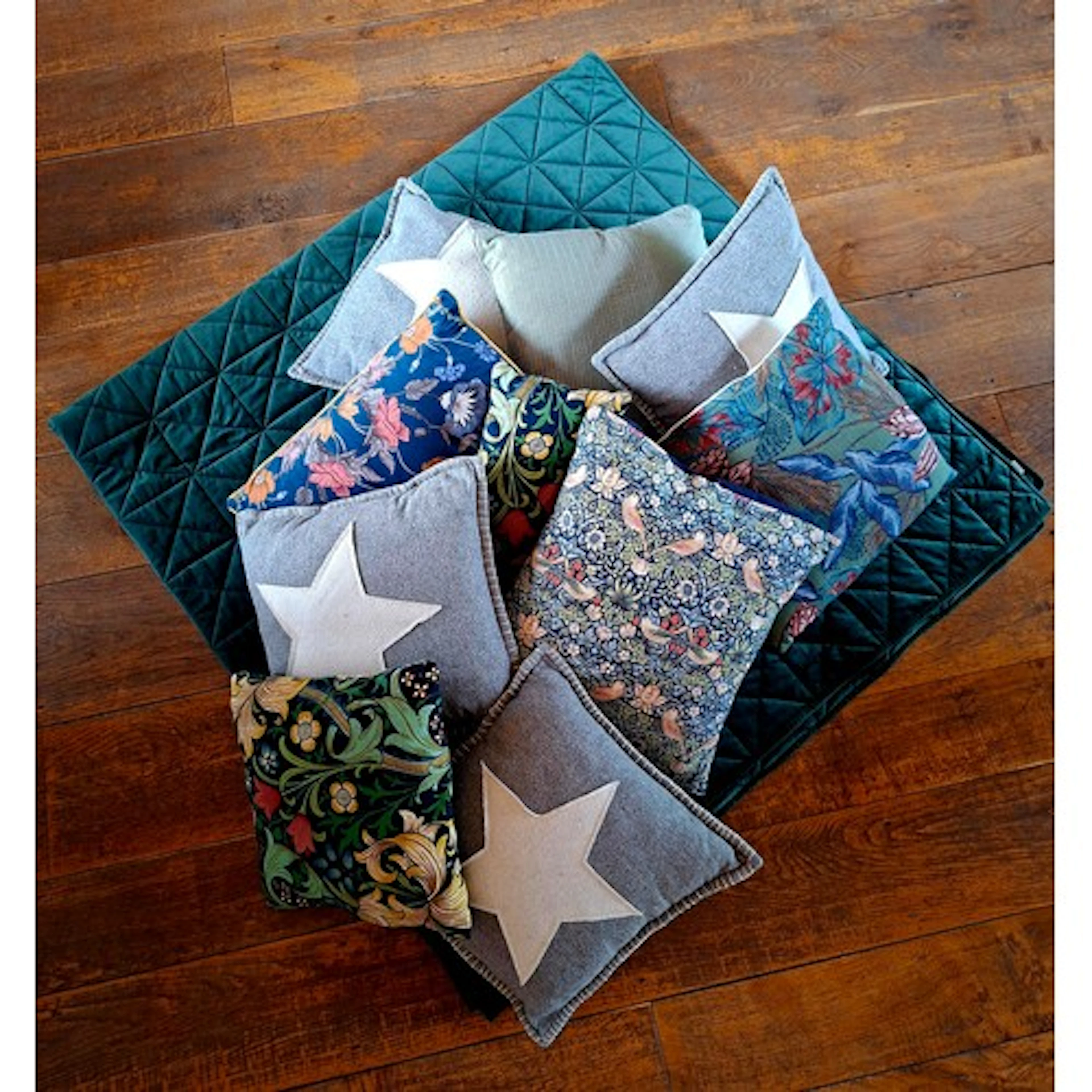 A modern king size green padded quilt together with a quanti...