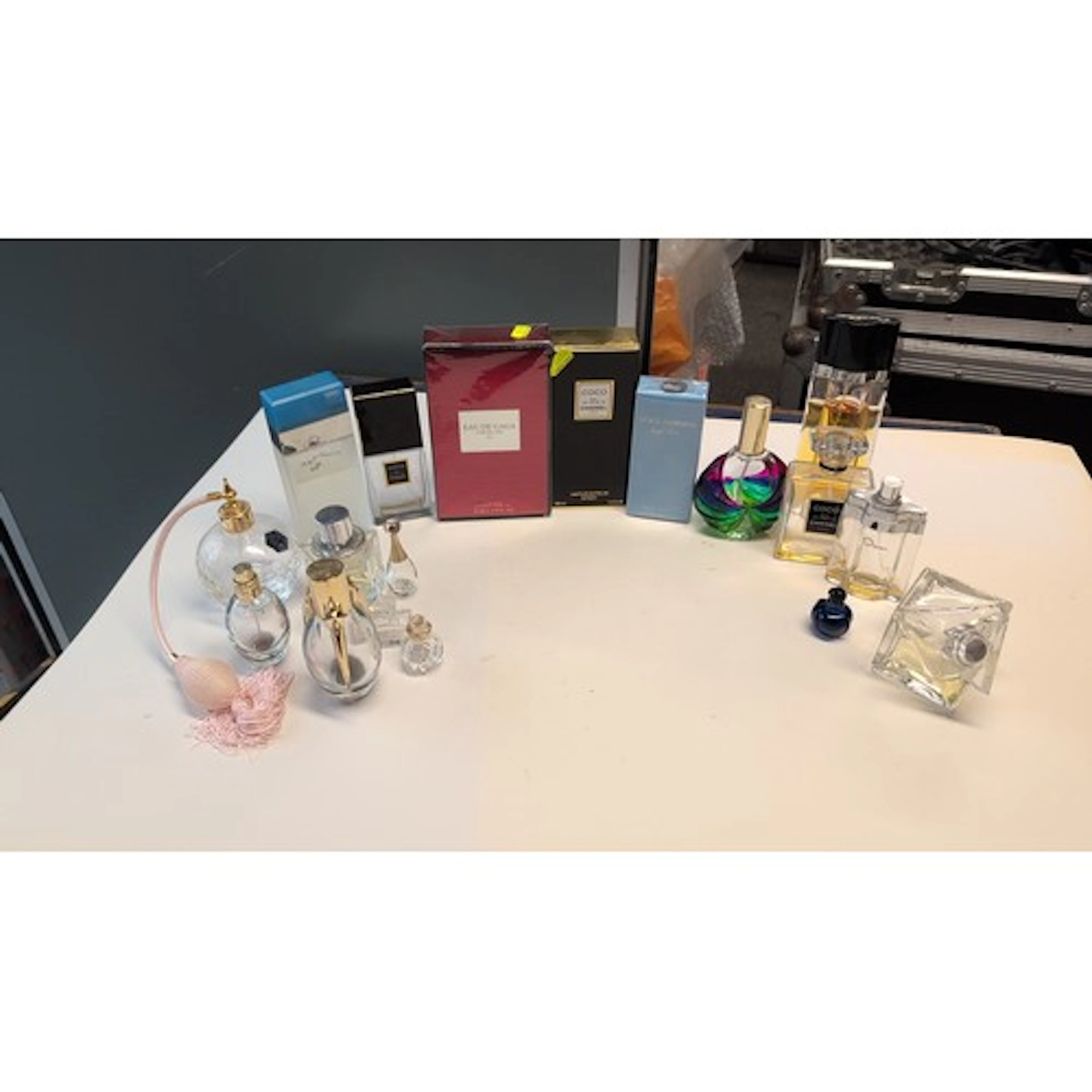 A group of contemporary fragrance bottles and boxed perfumes...