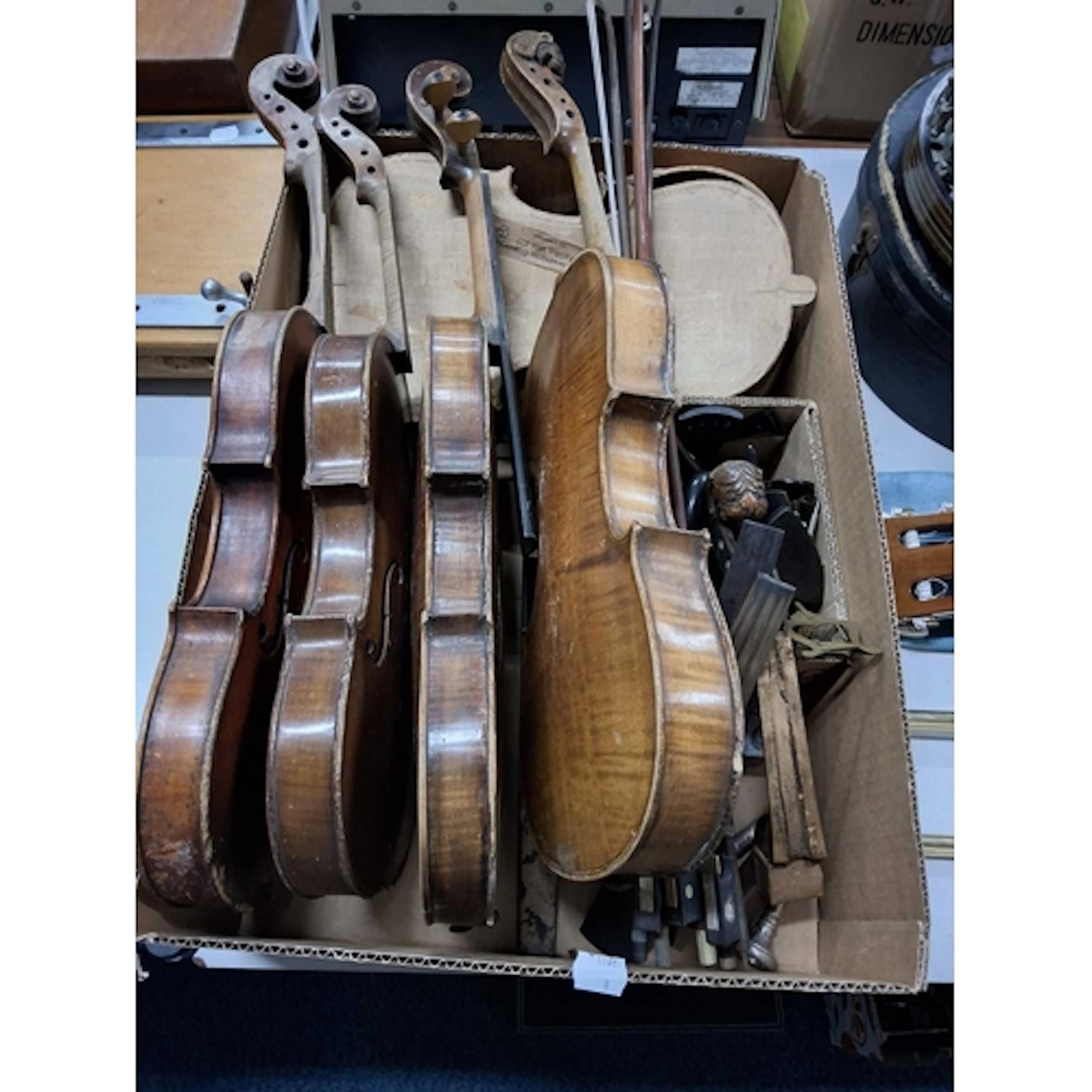 A BOX LOT OF VINTAGE VIOLIN RESTORATION PARTS AND BOWS, an e...