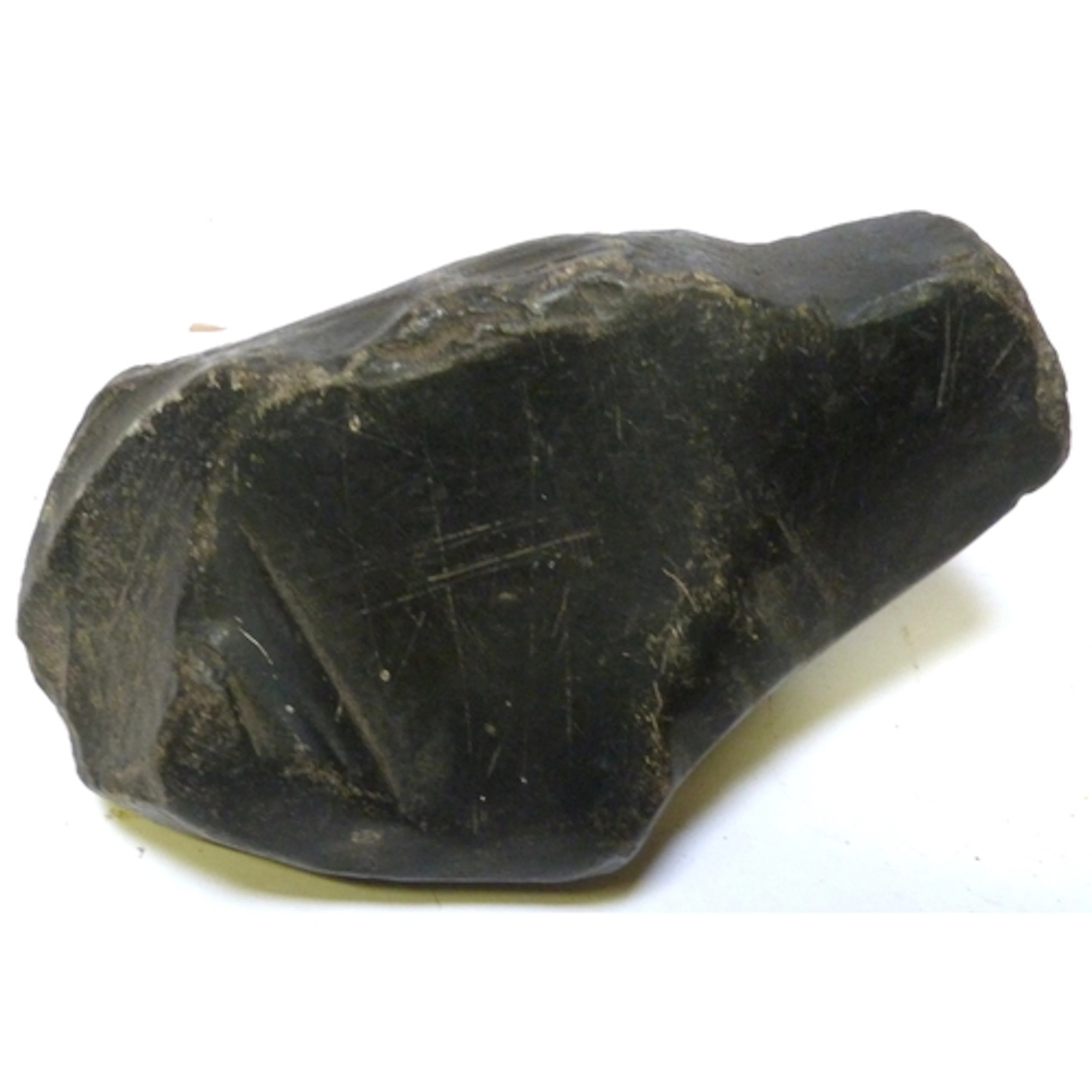 Ancient raw black stone fossil, resembling an Obsidian core ...