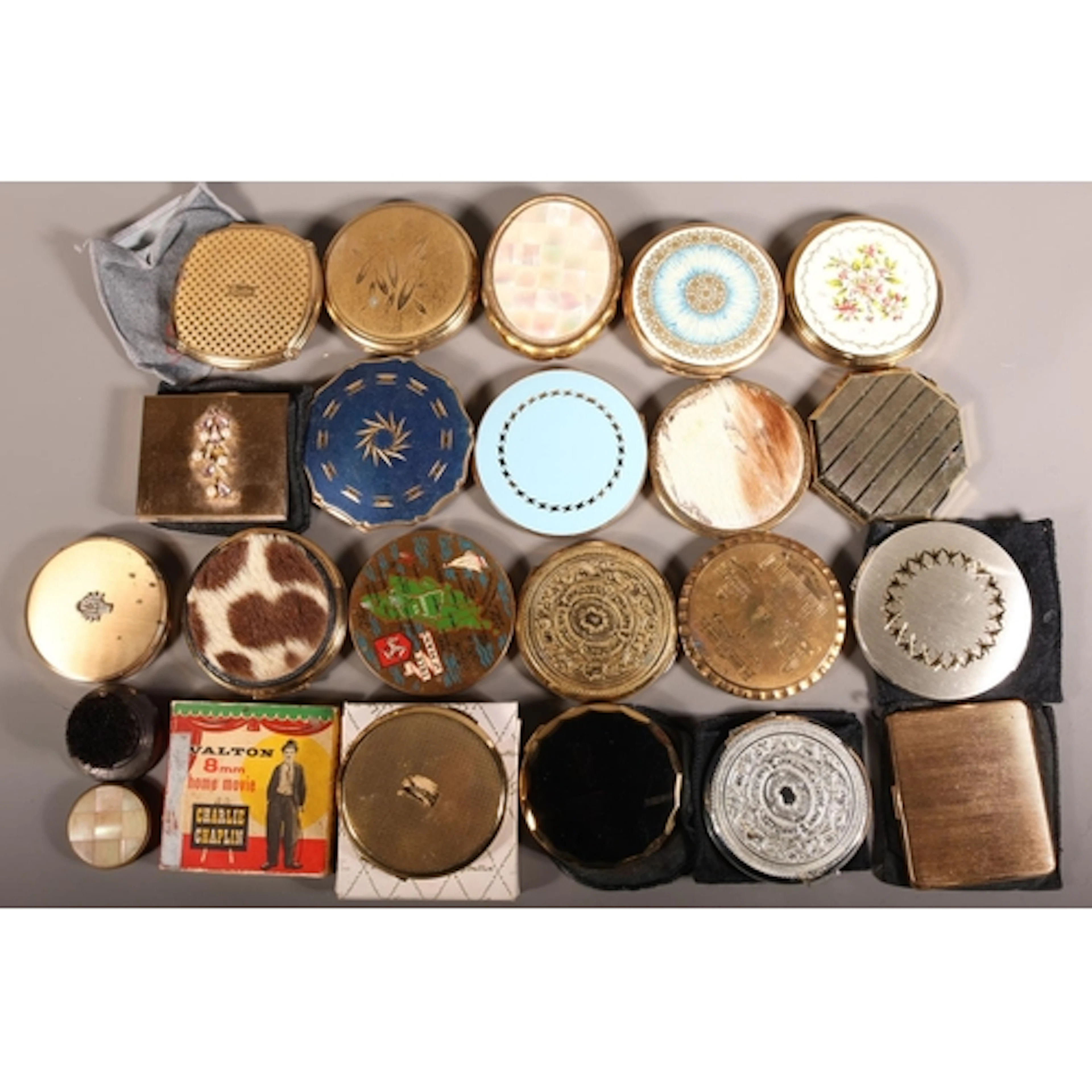 Quantity of compacts and 8mm home movie Charlie Chaplin.