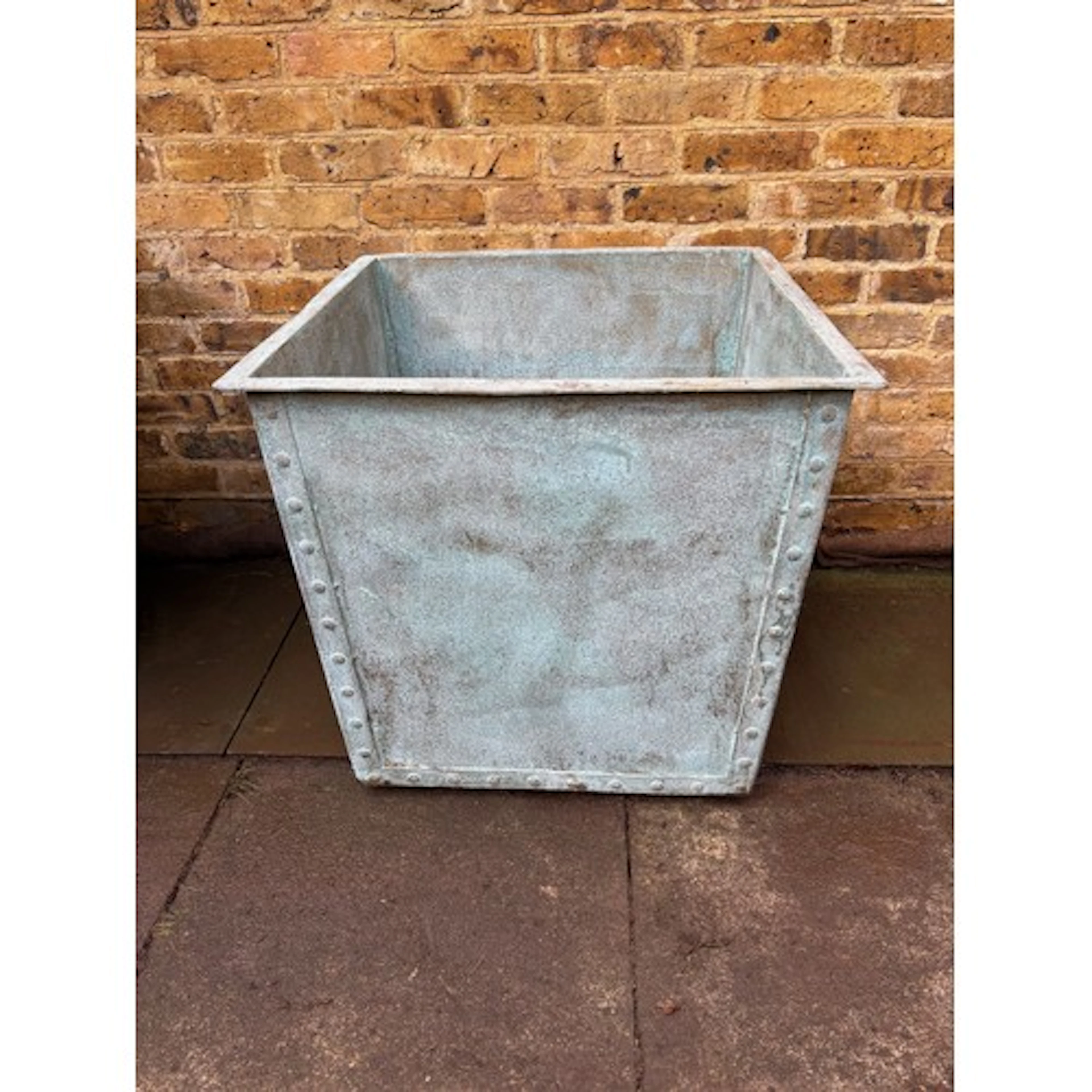 A large heavy square riveted hot dipped galvanised tub, verd...