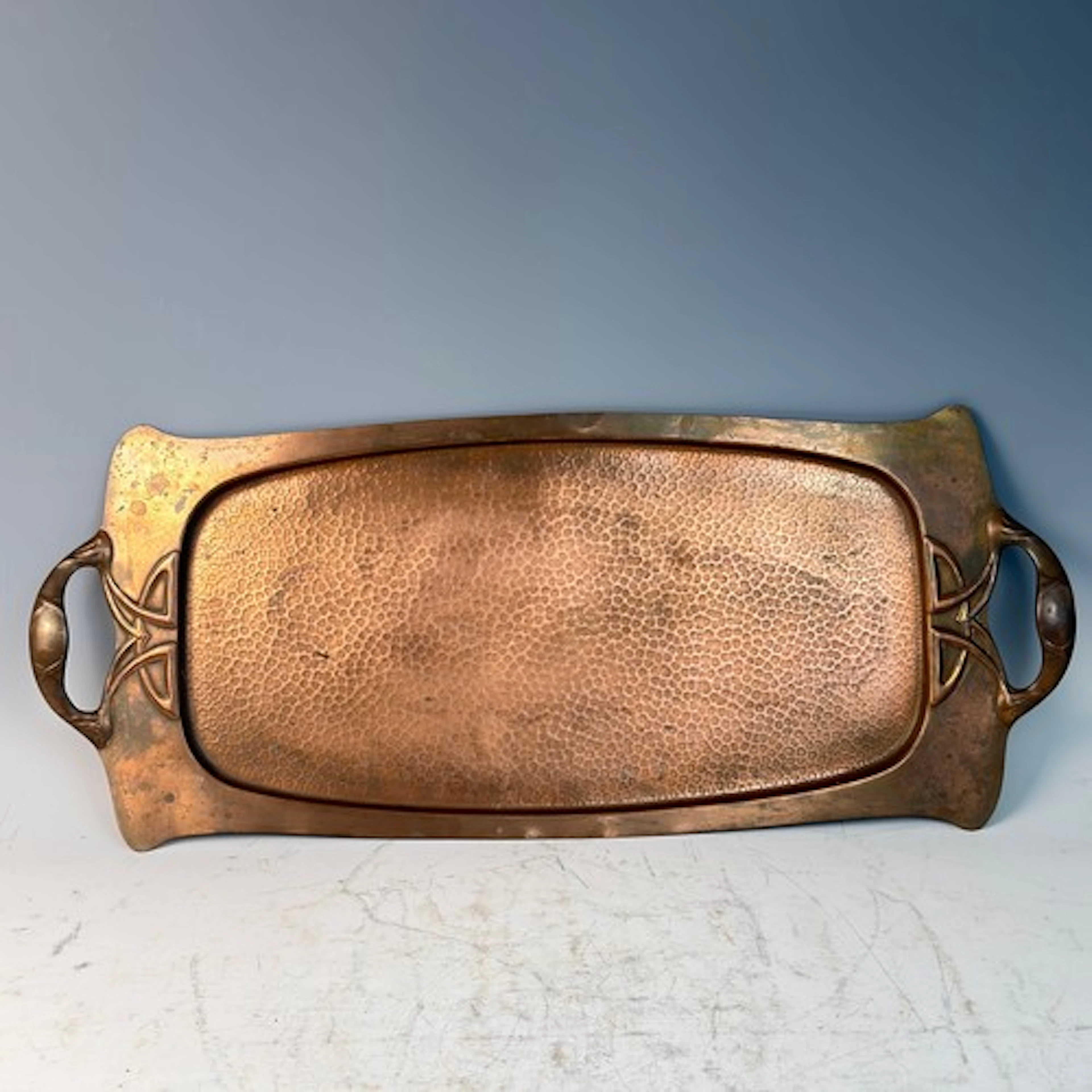 An Arts and Crafts twin-handled copper Tray, stamped 'J S &a...